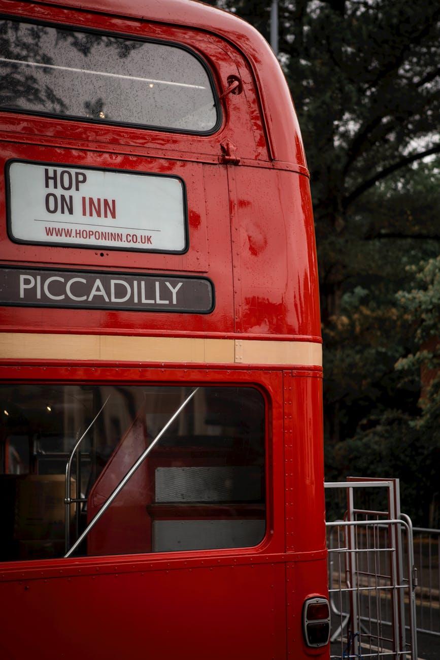 Rear of a vintage red double-decker bus marked Piccadilly