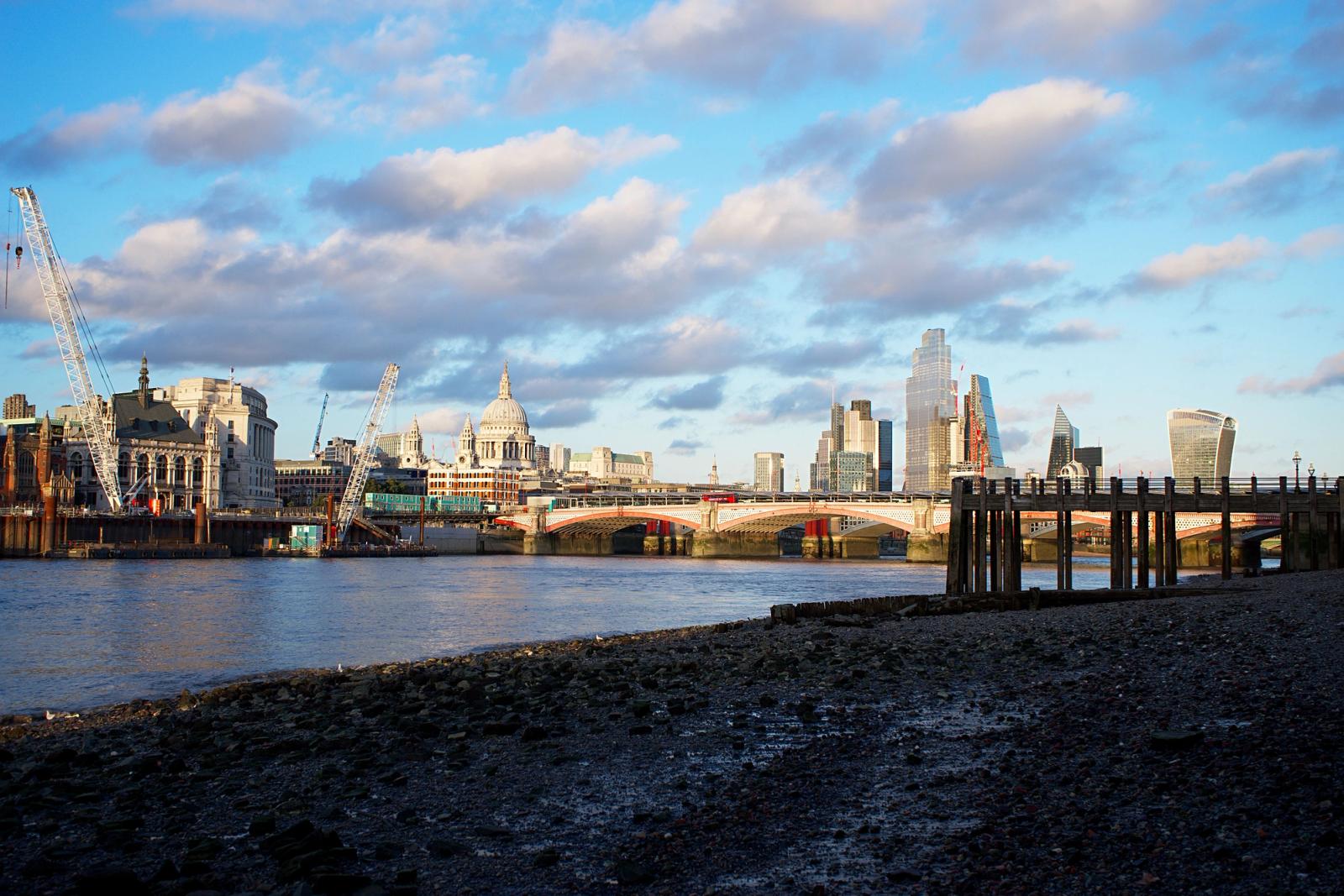 View of London's iconic skyline, featuring St Paul's Cathedral and the cityscape by the river