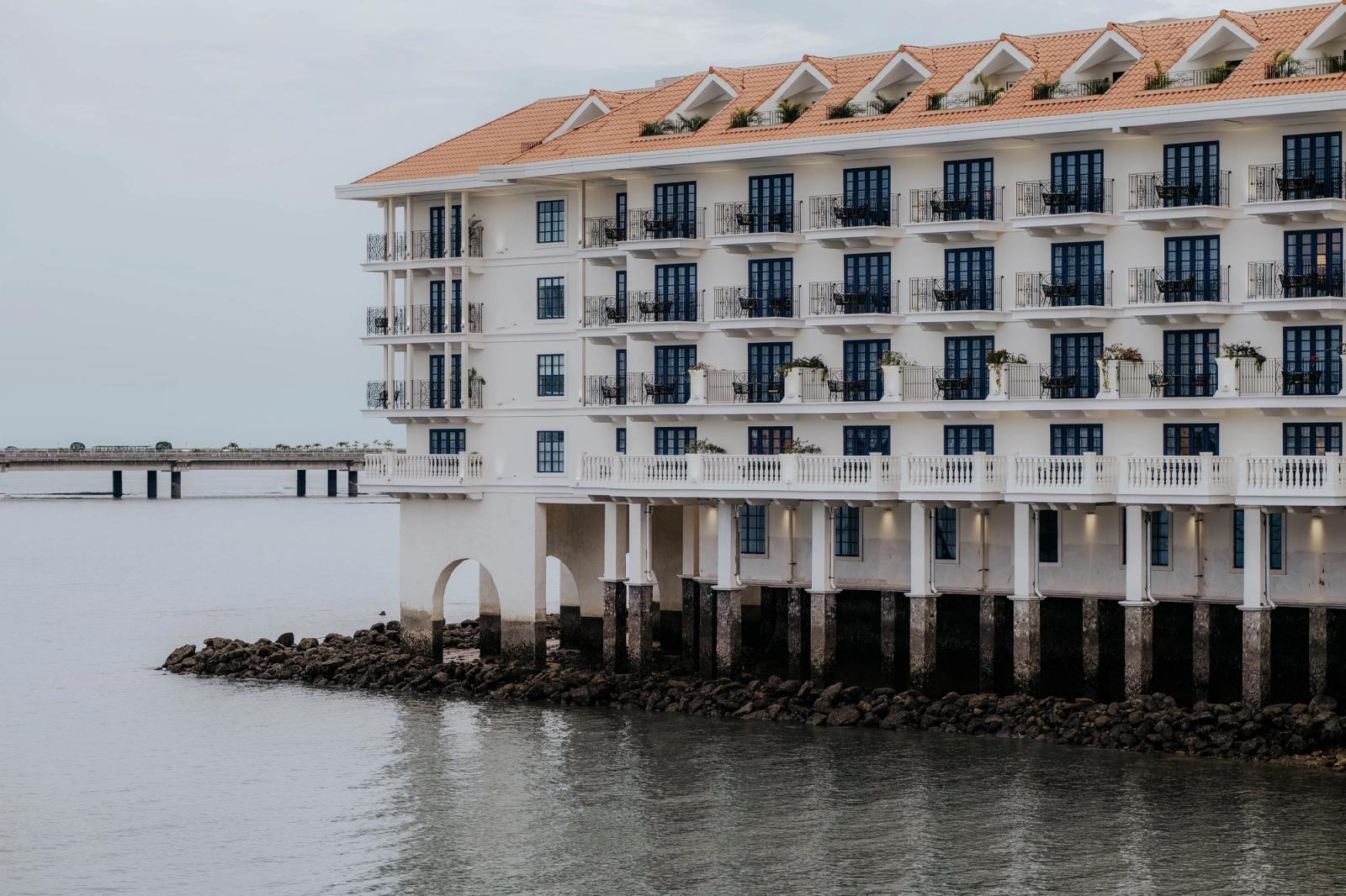 Elegant waterfront hotel facade in Panama City with ocean view and classic architecture