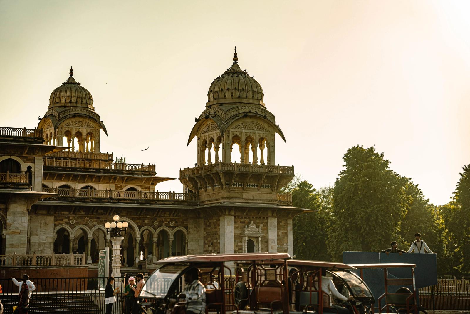 Domed towers of a colonial-era museum building at golden hour