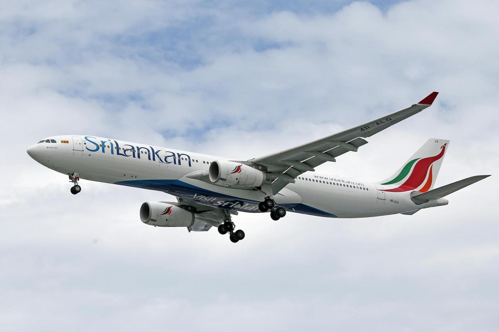A passenger jet climbing through clouds after takeoff