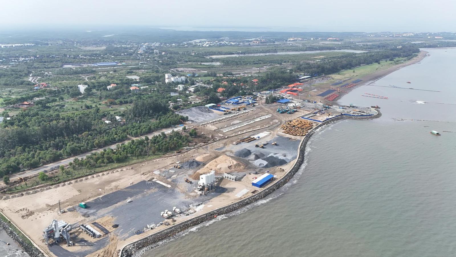 Aerial view of a coastal construction and port site under development