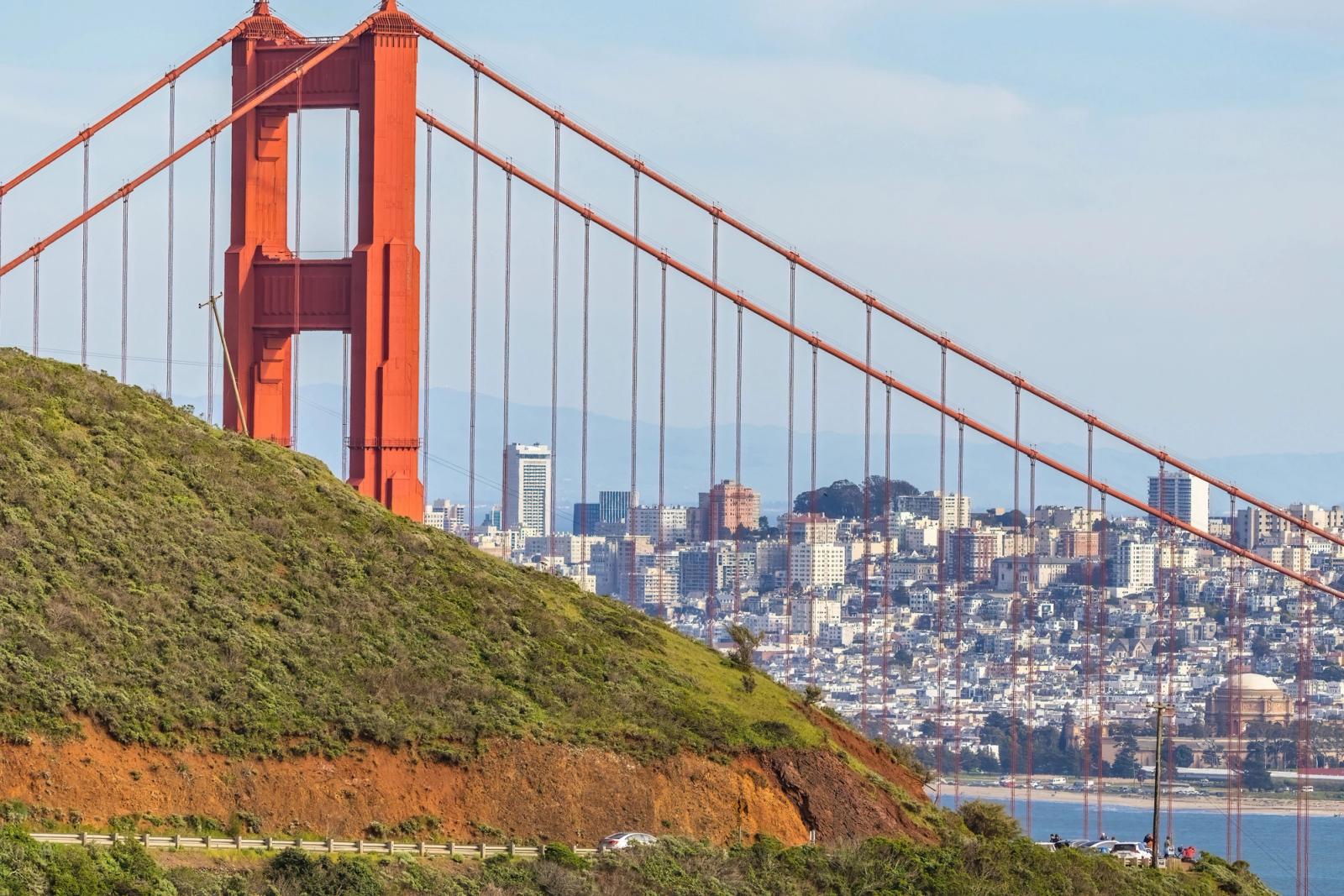 Iconic view of the Golden Gate Bridge and San Francisco skyline from a hillside