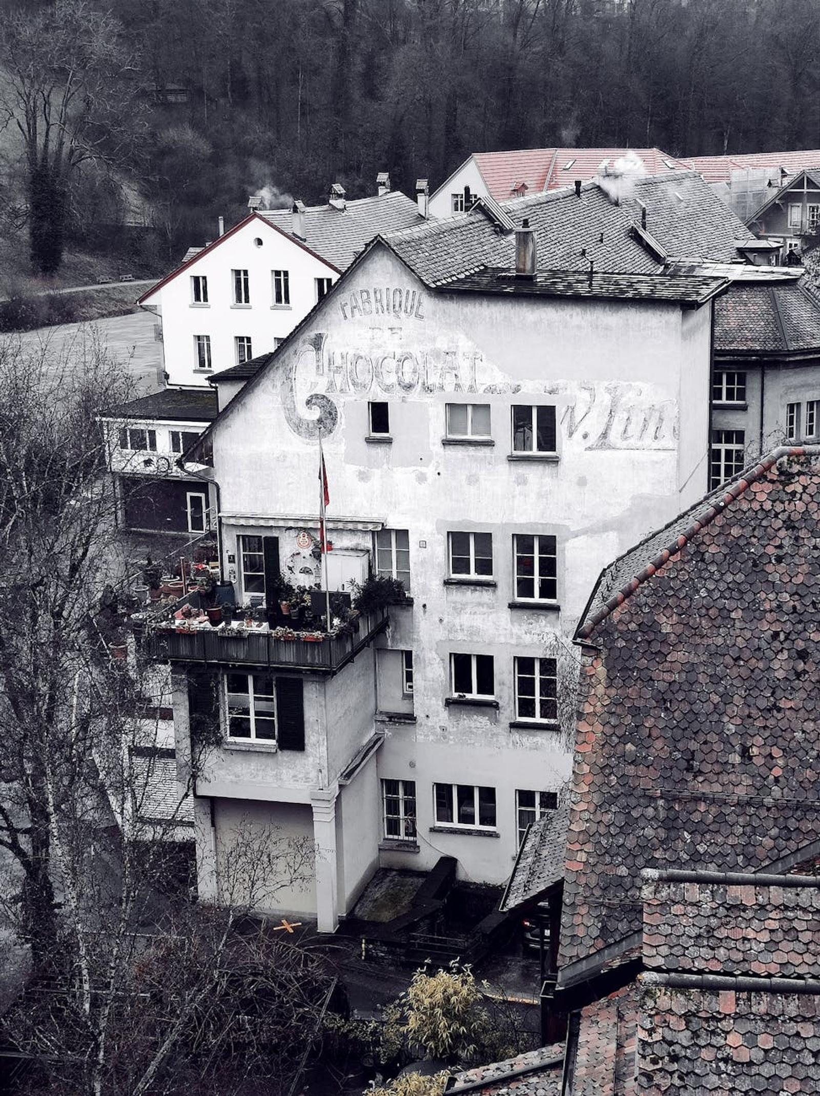Aerial view of a historic building in Bern with vintage signage and classic Swiss architecture