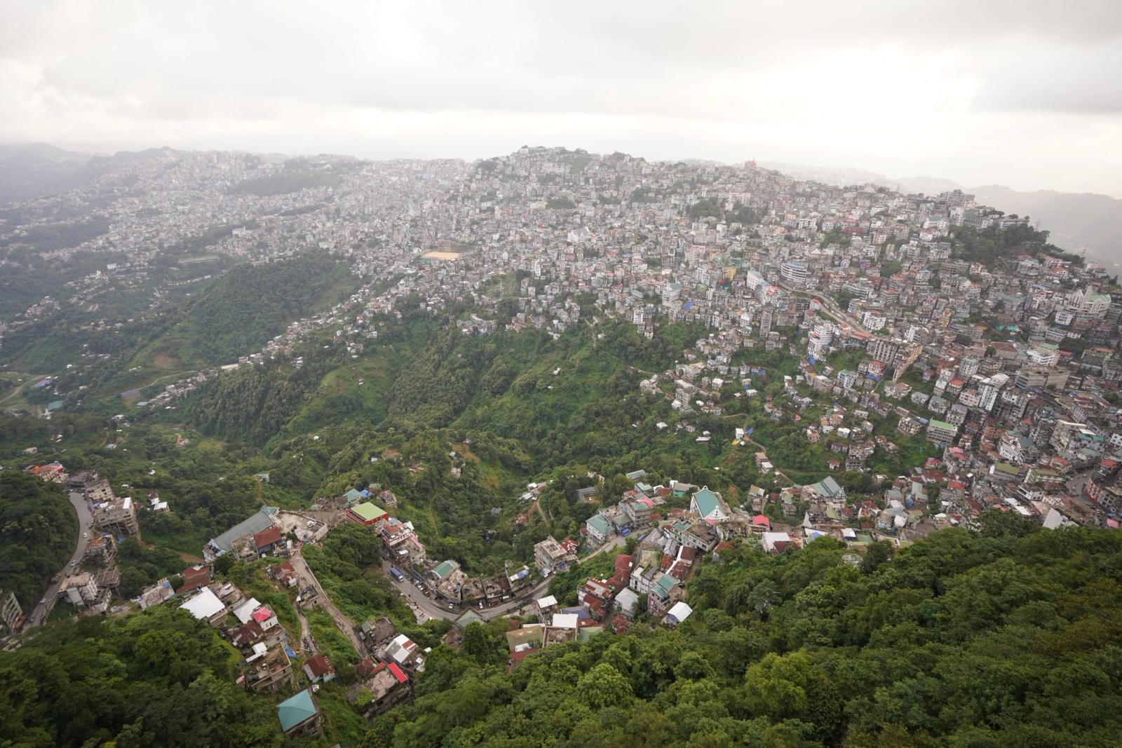 Scenic aerial view showcasing the sprawling city of Aizawl nestled among lush hills in Mizoram, India