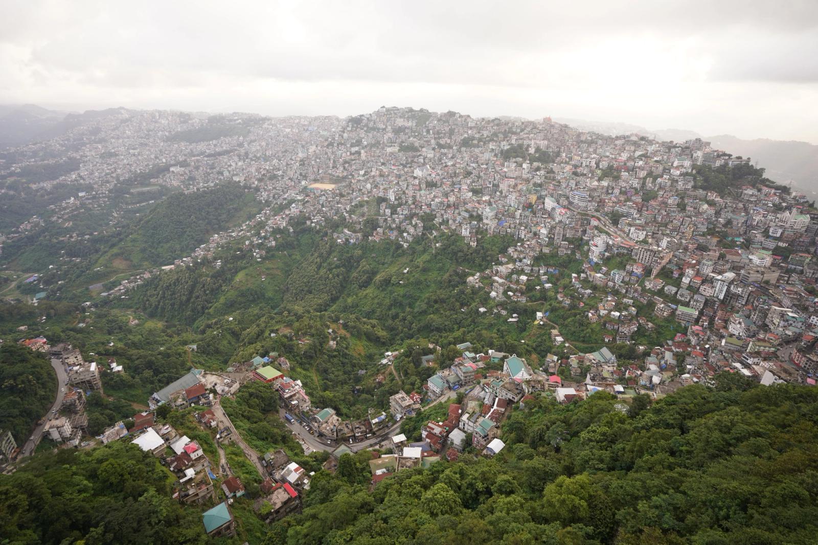 Scenic aerial view showcasing the sprawling city of Aizawl nestled among lush hills in Mizoram, India