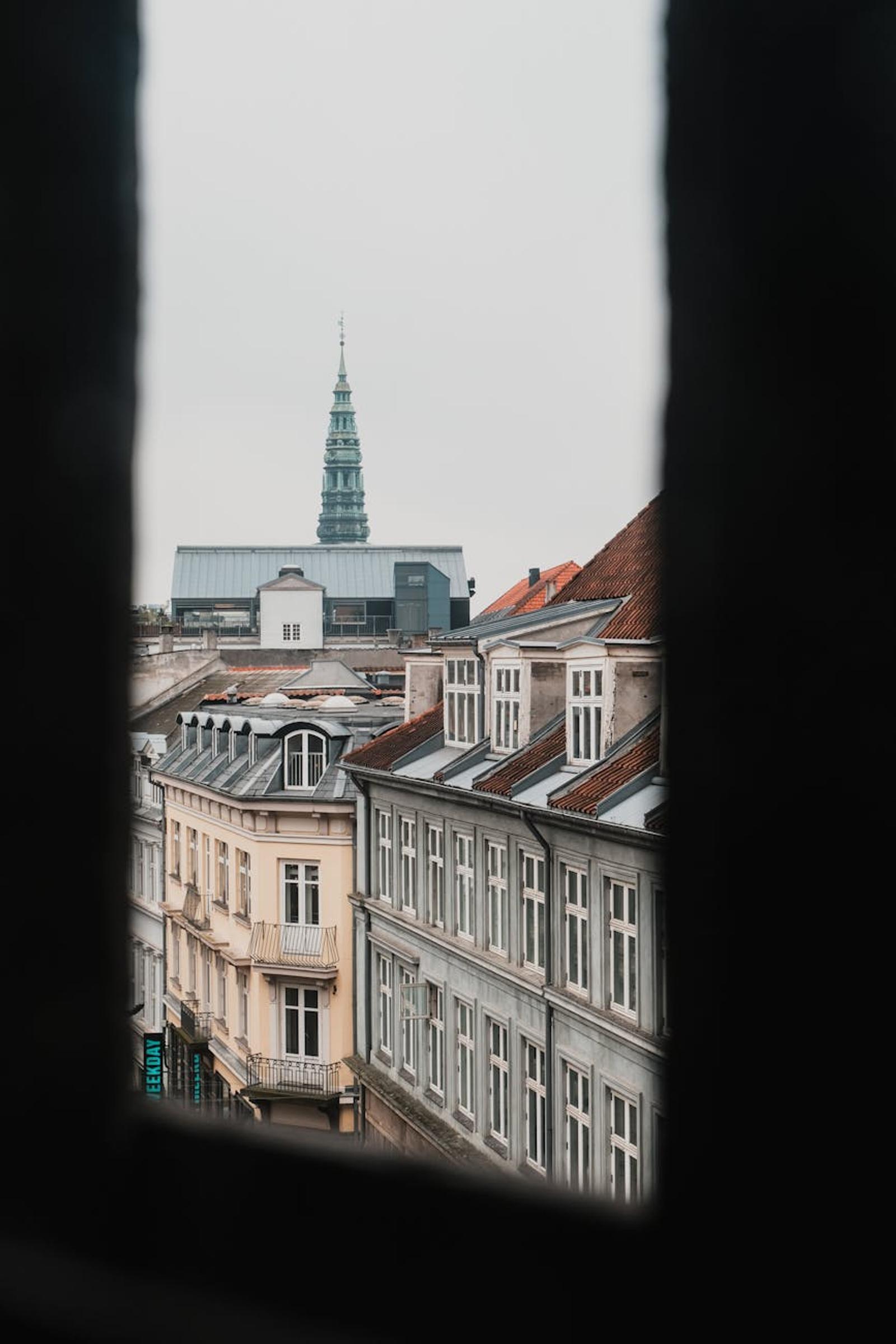 A view of Copenhagen's streets and historic architecture on an overcast day