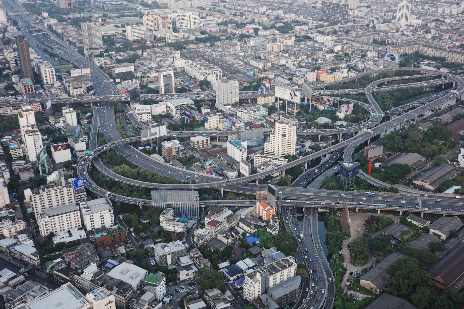 Aerial shot of urban expressways and skyline in Bangkok, Thailand