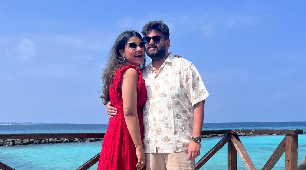 Couple clicking photo standing on a dock