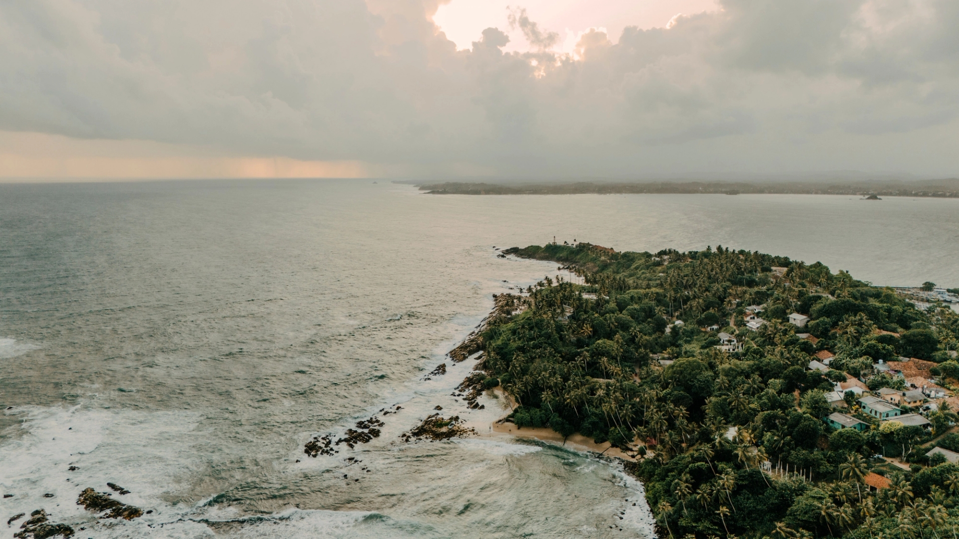Captivating aerial view of Sri Lanka's lush coastline during a tranquil sunset
