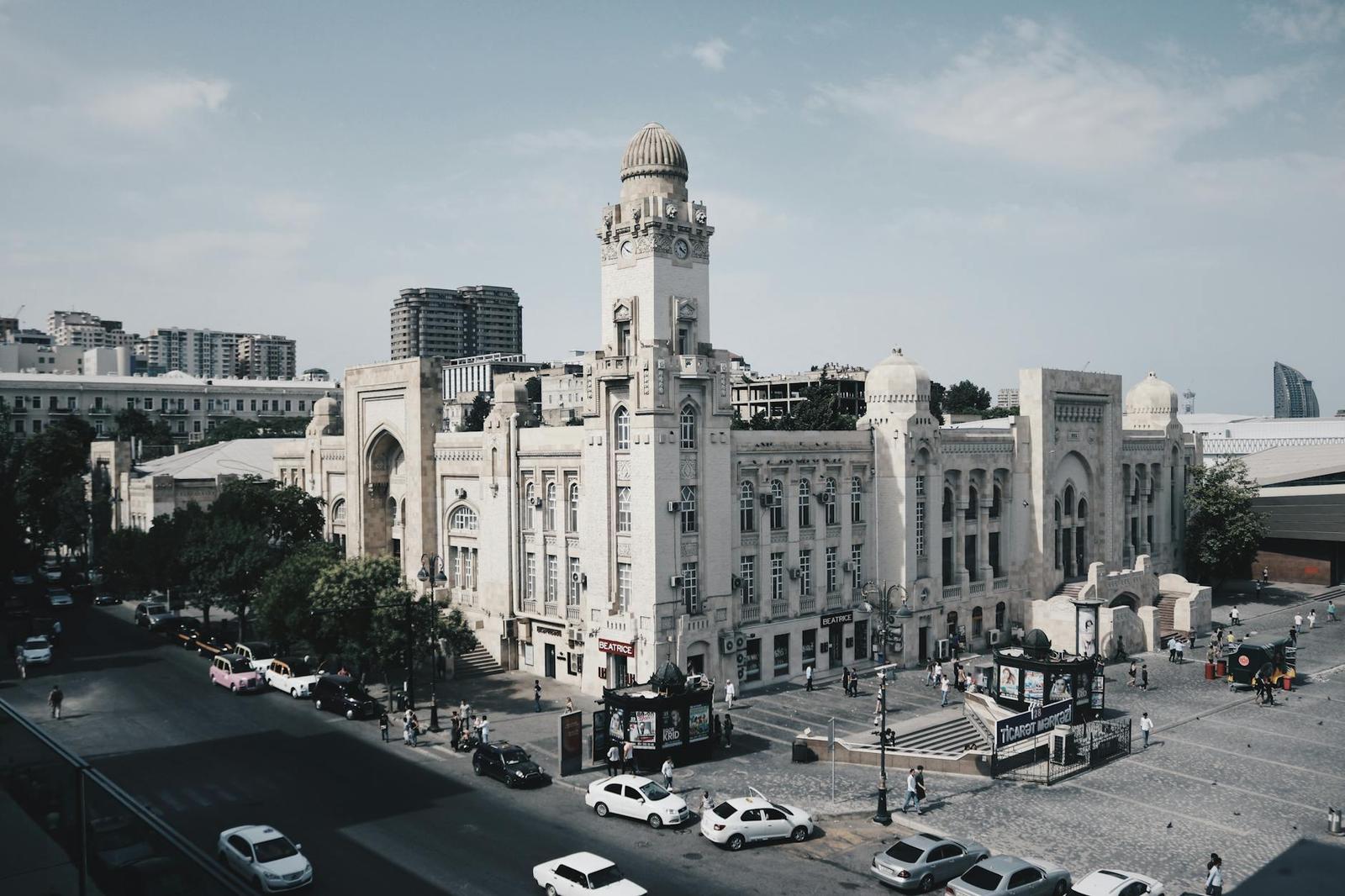 Discover the architectural charm of Baku Railway Station in this lively urban scene