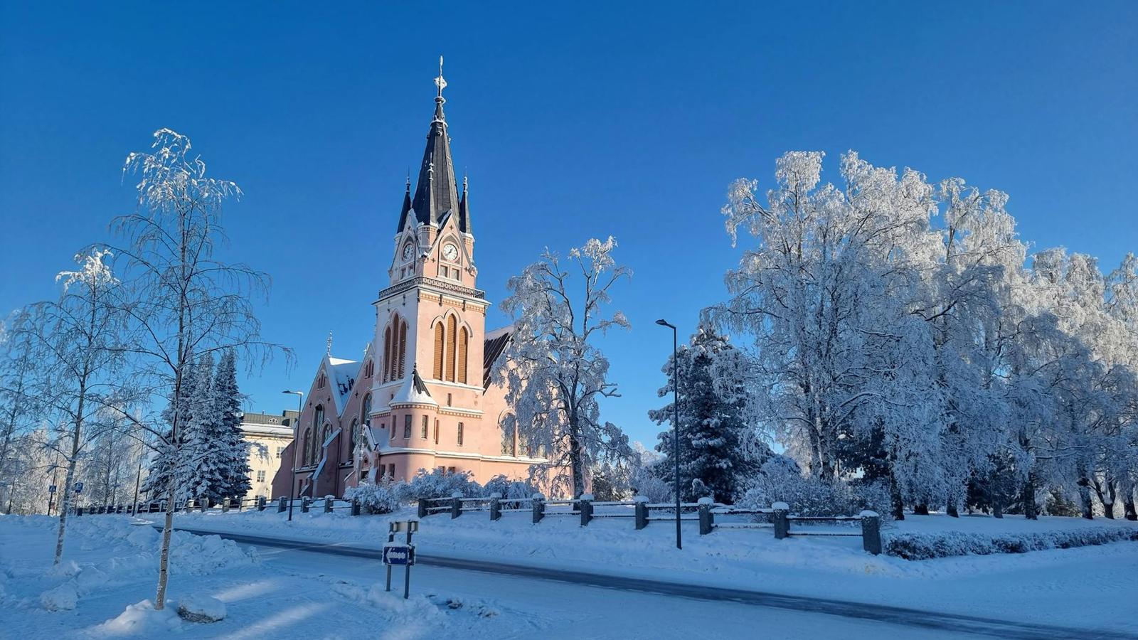 Beautiful snowy church in a serene winter landscape, Lapland, Finland