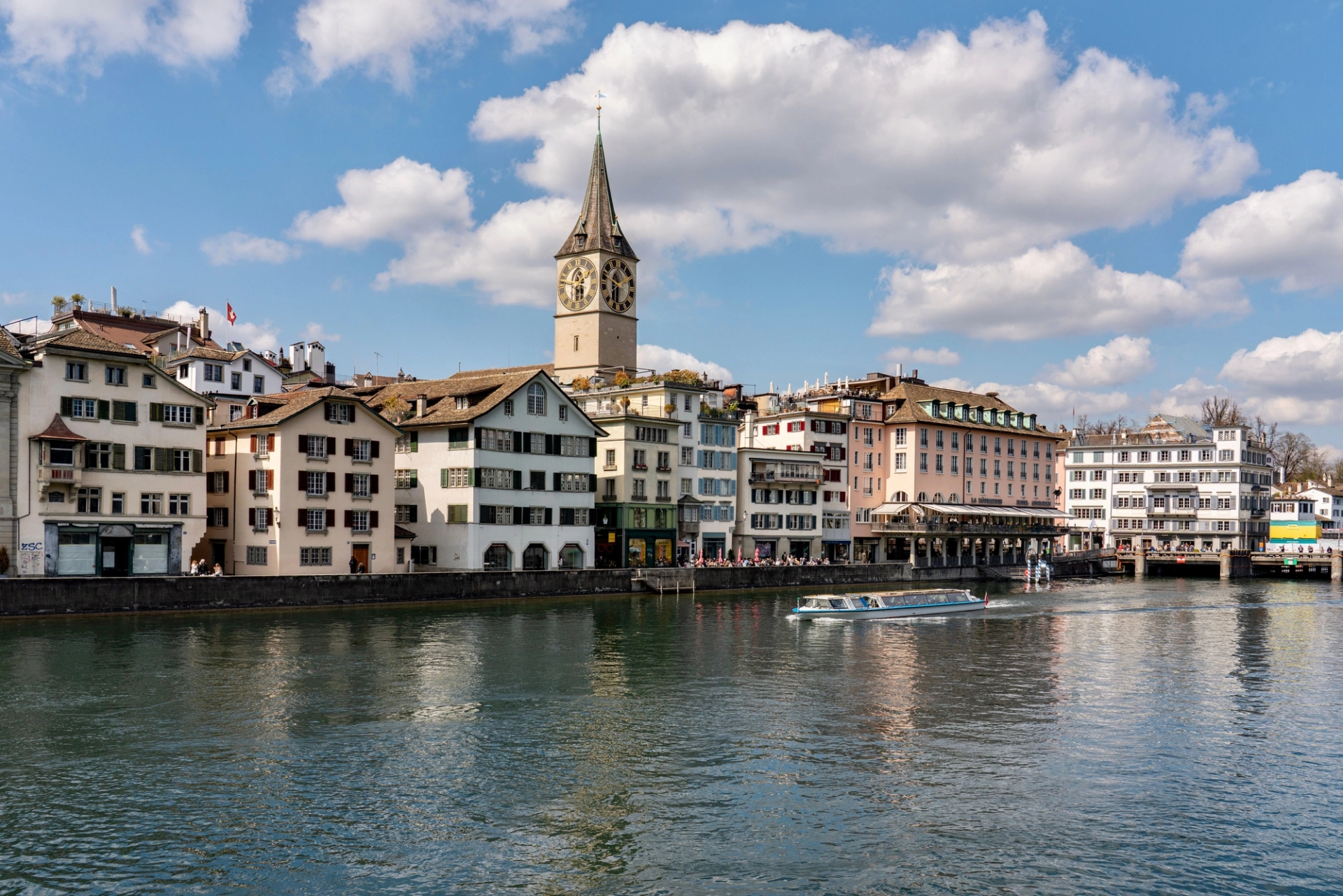 Scenic view of St. Peter's Church by the Limmat River in Zurich, Switzerland
