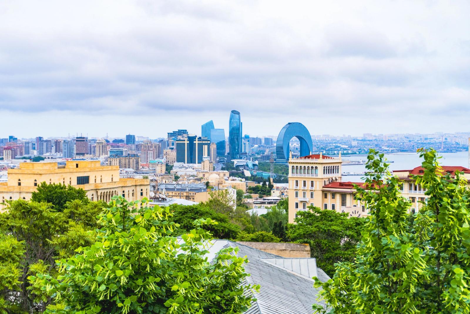 Stunning view of Baku cityscape with modern architecture and lush greenery