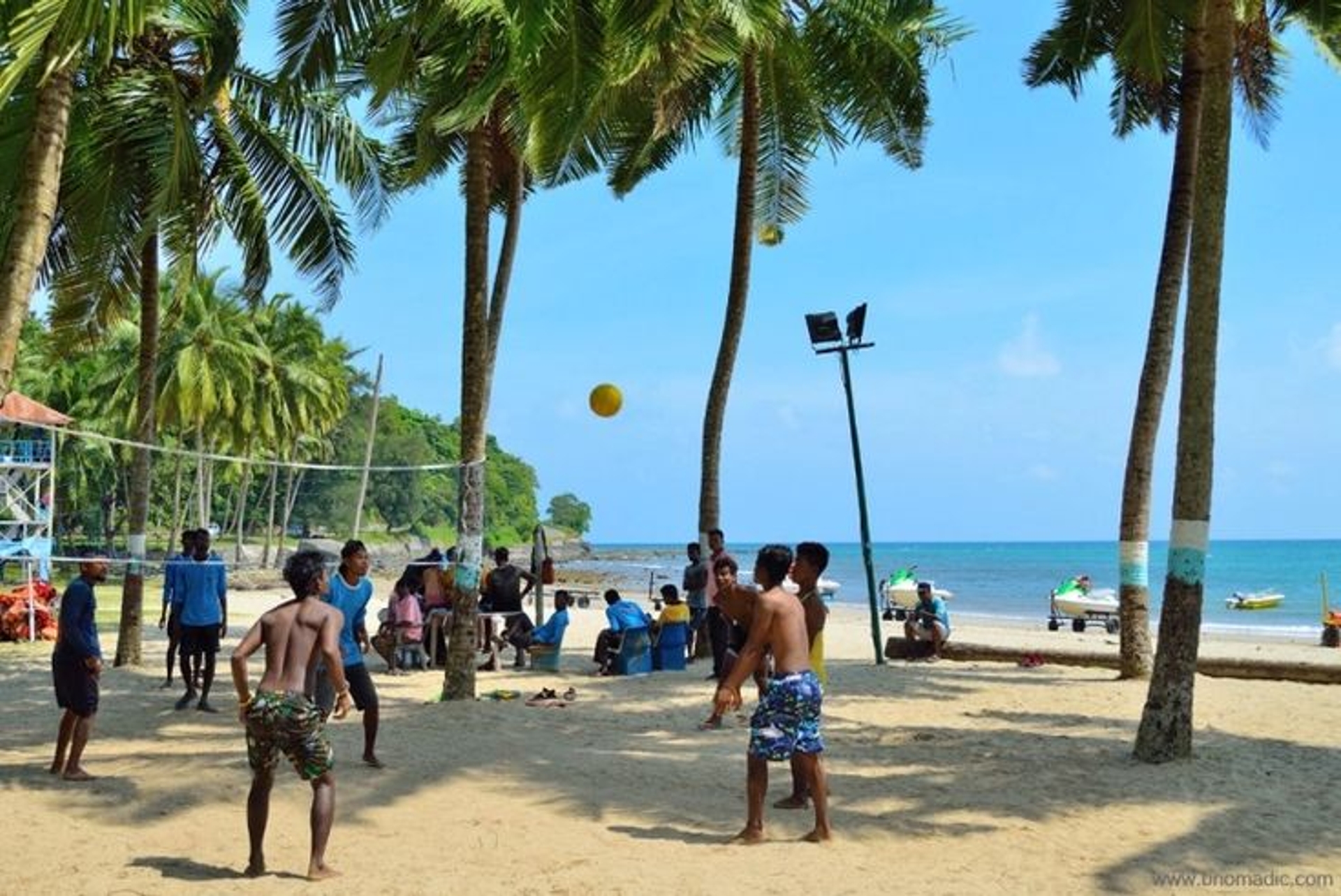 Tranquil beachfront landscape in Andaman with clear skies and lush greenery