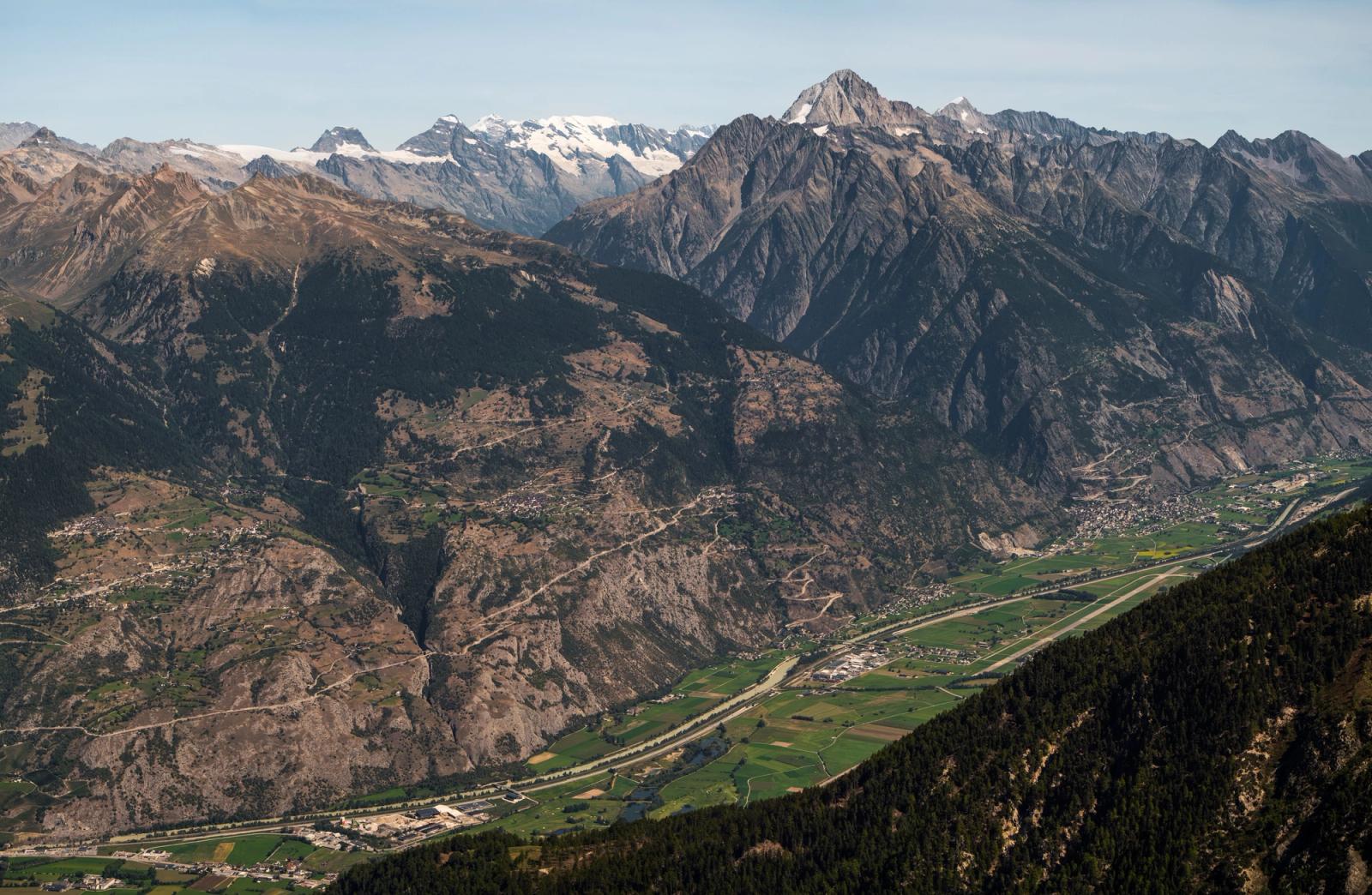 Panoramic view of Anniviers valley in Switzerland with majestic Swiss Alps under a clear blue sky