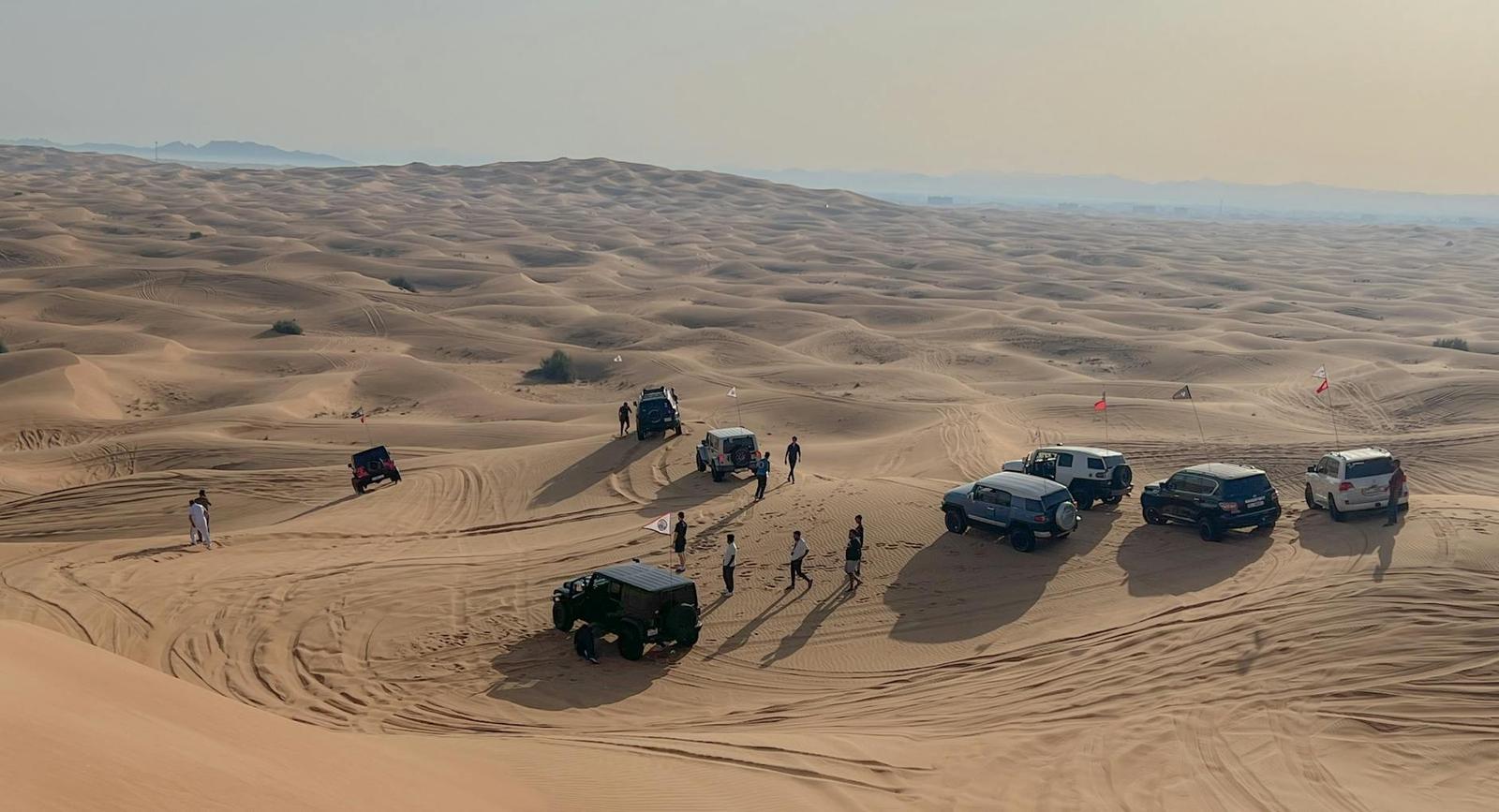 Land Cruiser cresting a dune on a Dubai desert safari
