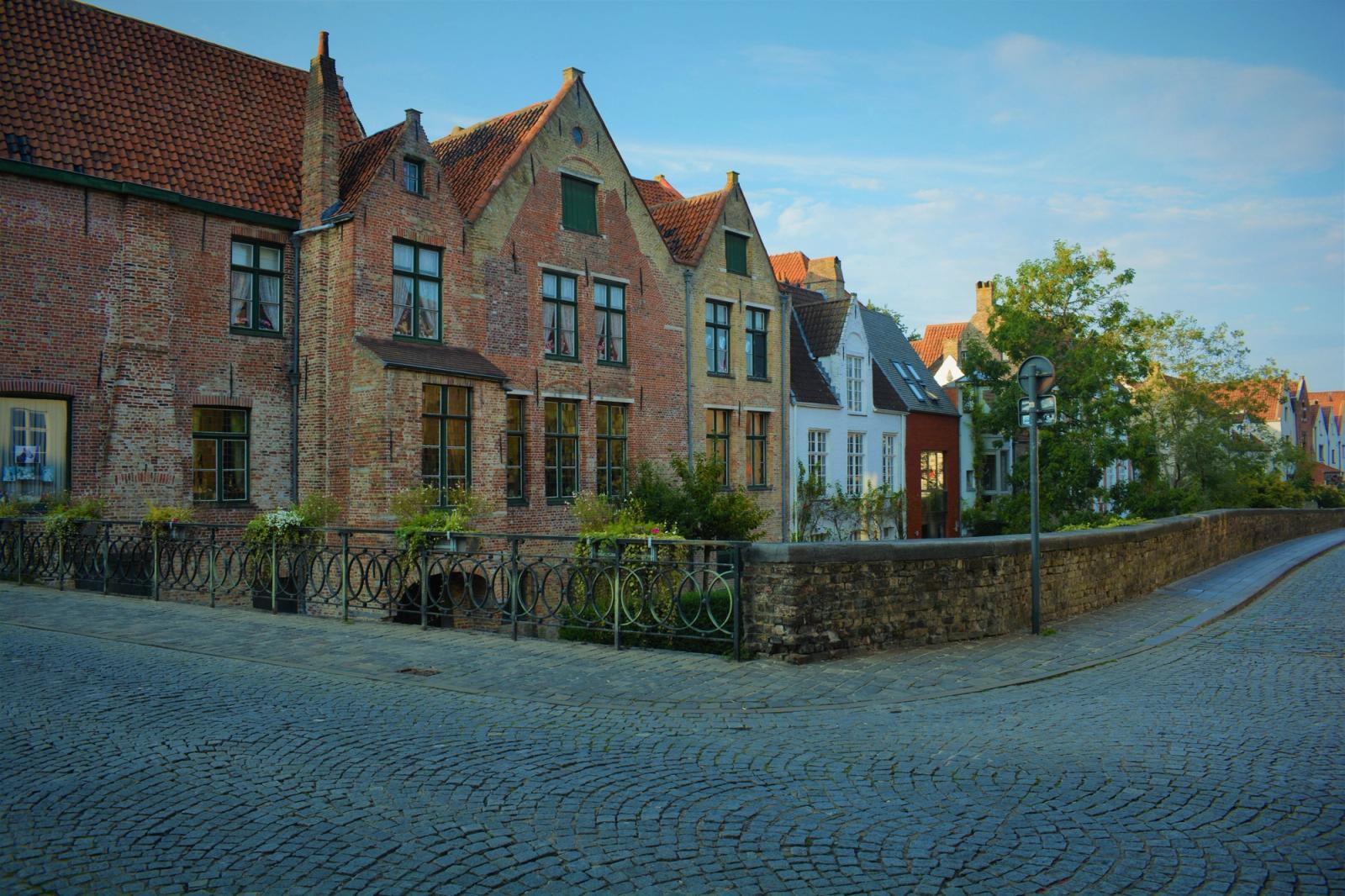 Picturesque view of medieval houses lining a cobblestone street in Bruges, Belgium