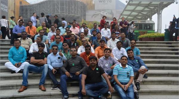 Group of people seating and  posing together