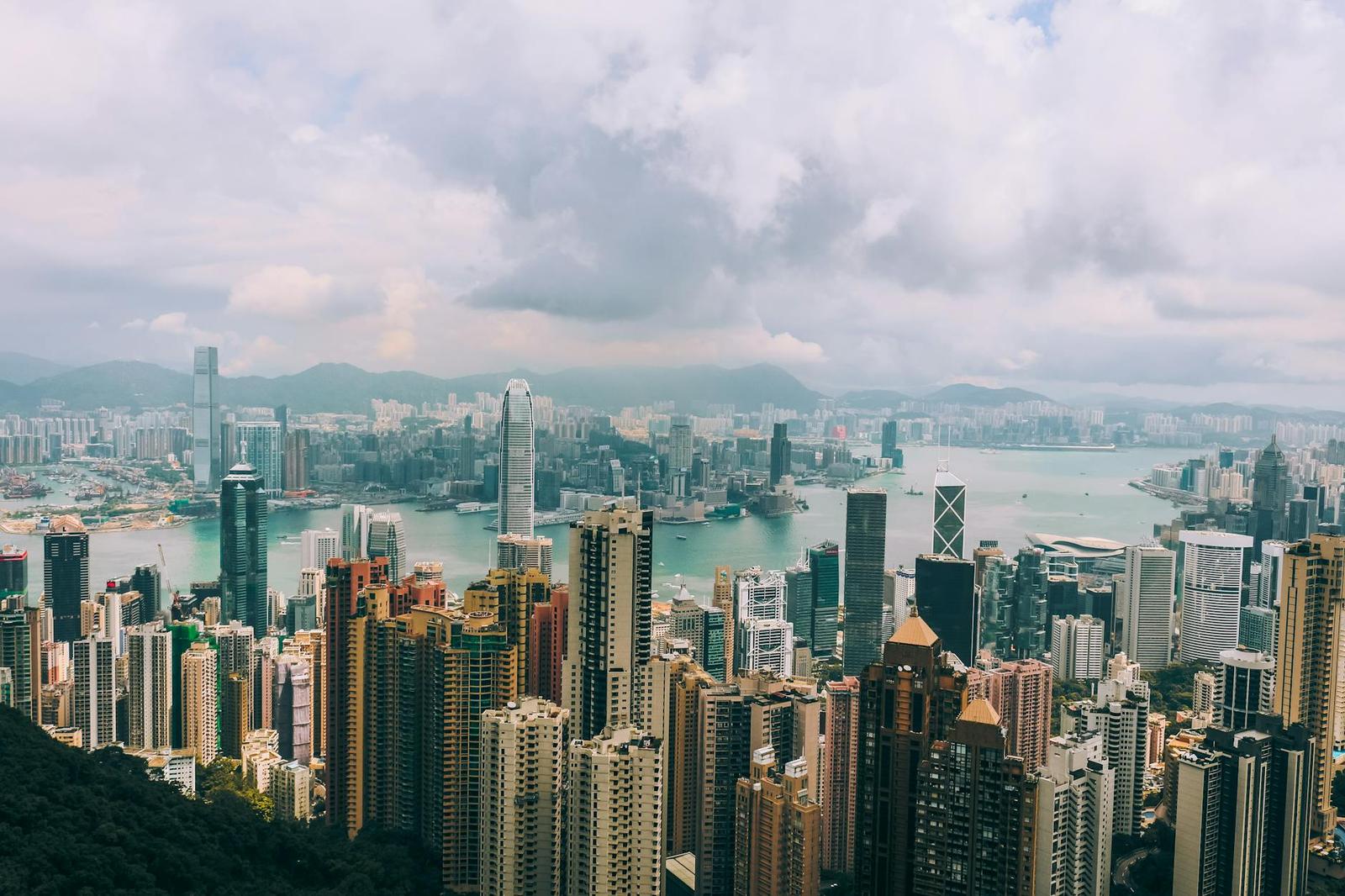 Panoramic view of Hong Kong skyline with skyscrapers and Victoria Harbour from Victoria Peak