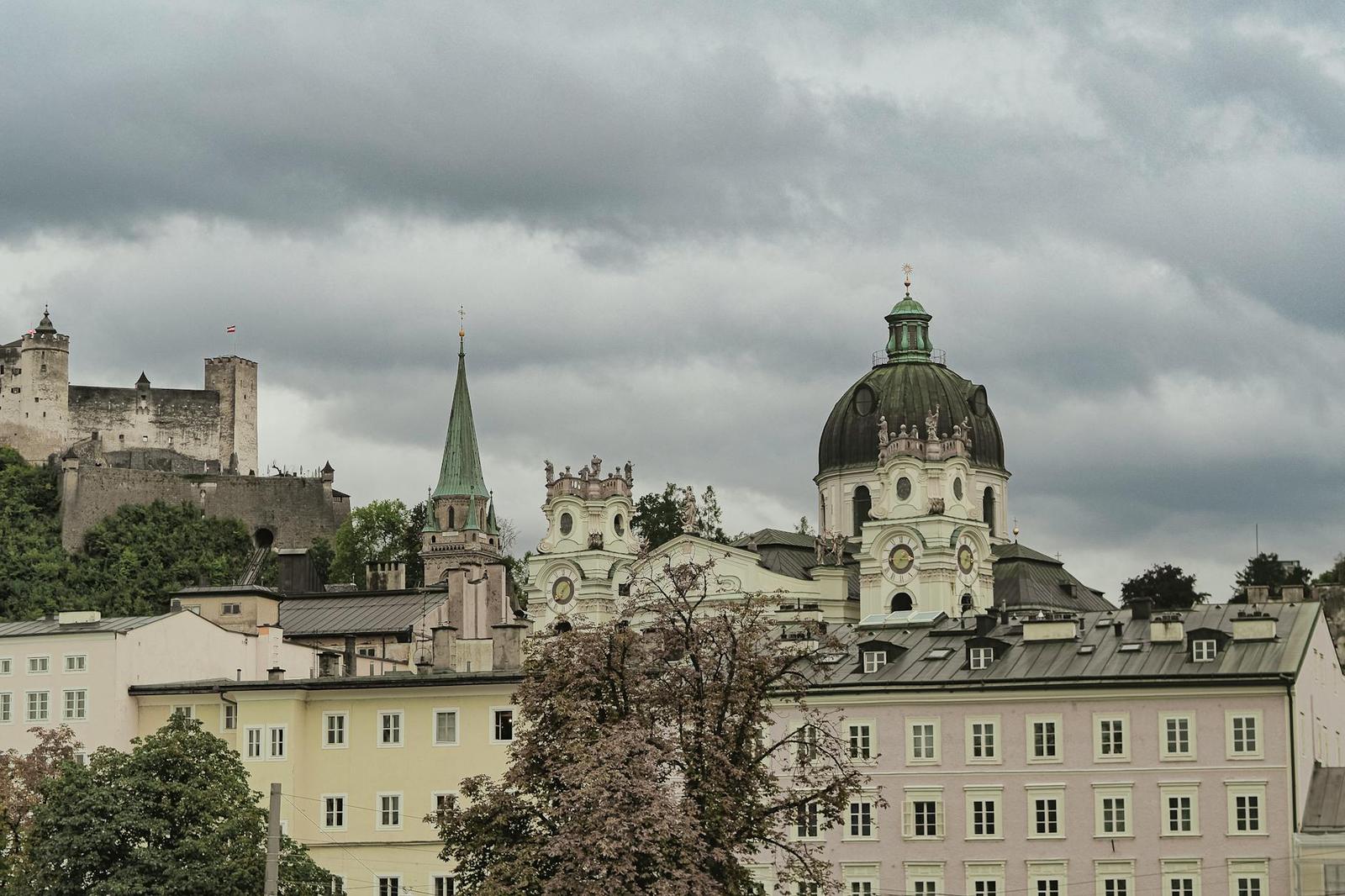 Explore the architectural charm of Salzburg's Dom Quartier with Hohensalzburg Fortress in the backdrop