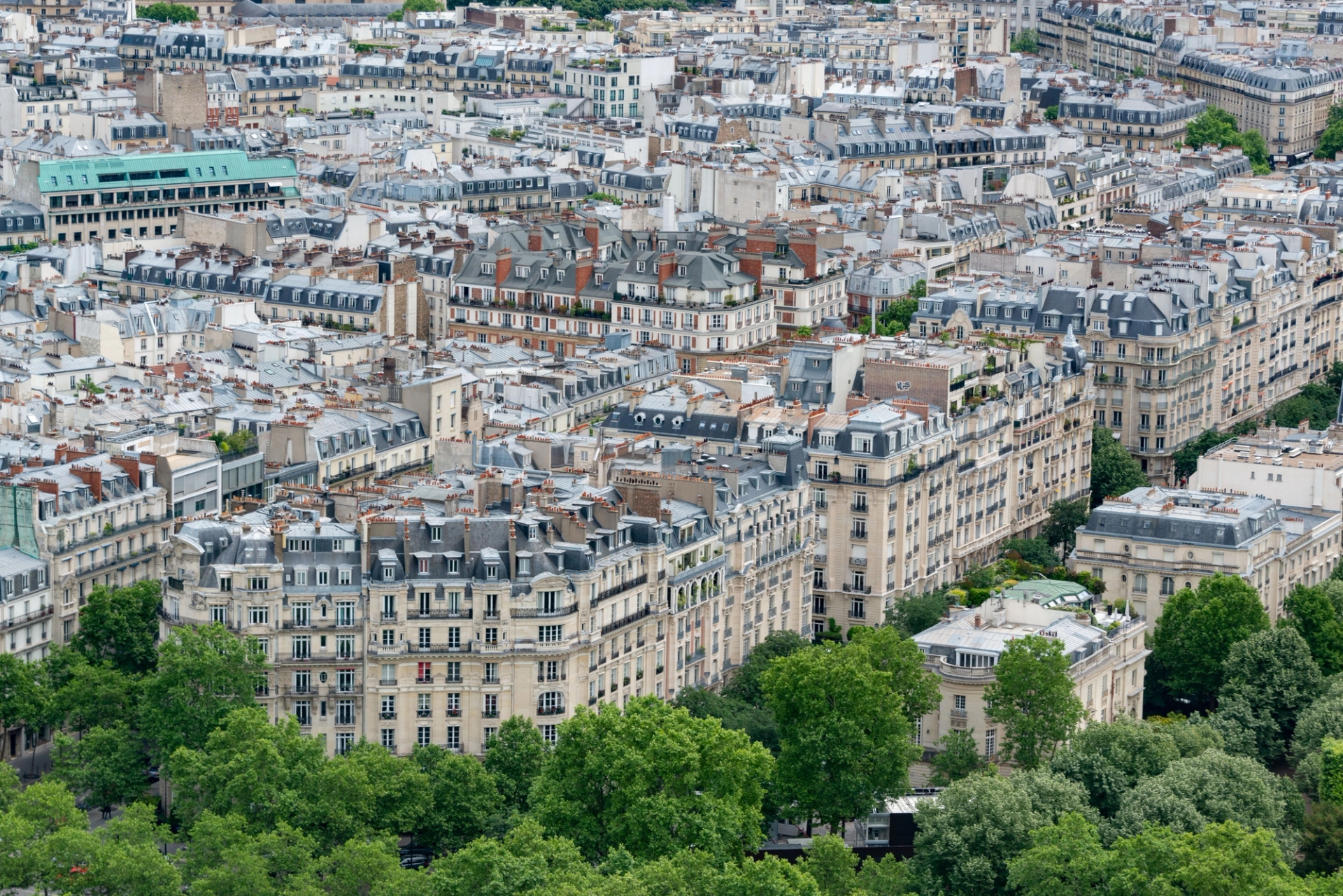 Stunning aerial view of classic Parisian architecture and rooftops, showcasing the city's unique charm