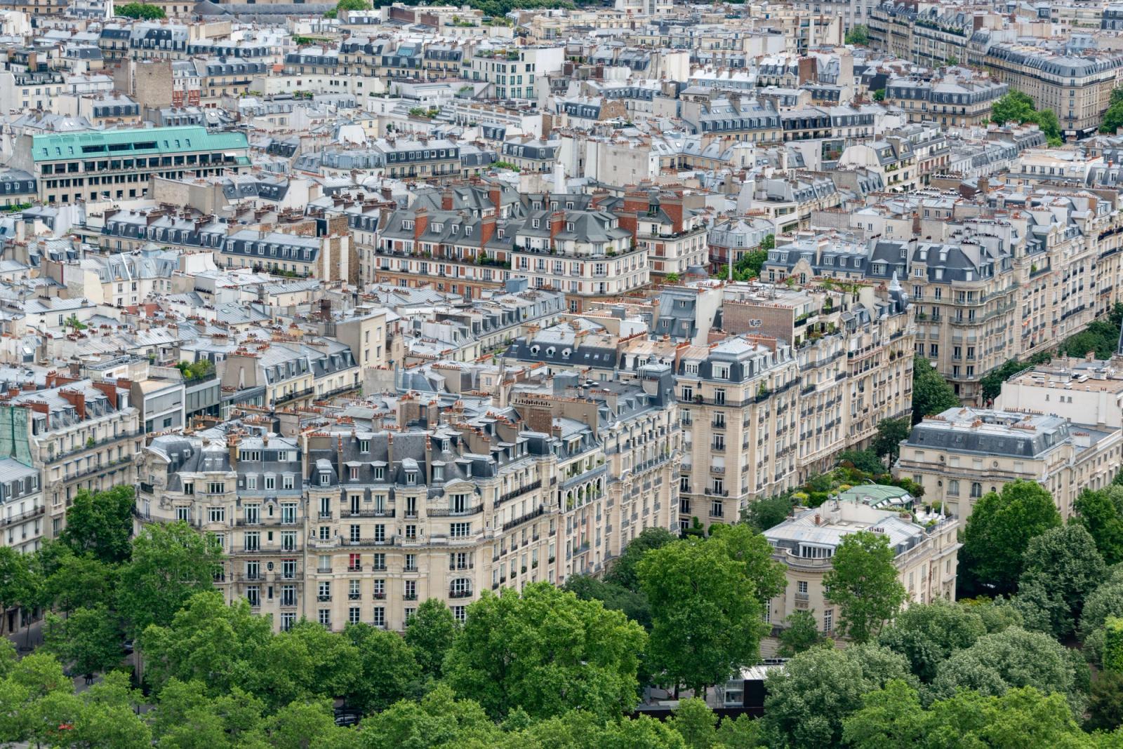 Stunning aerial view of classic Parisian architecture and rooftops, showcasing the city's unique charm