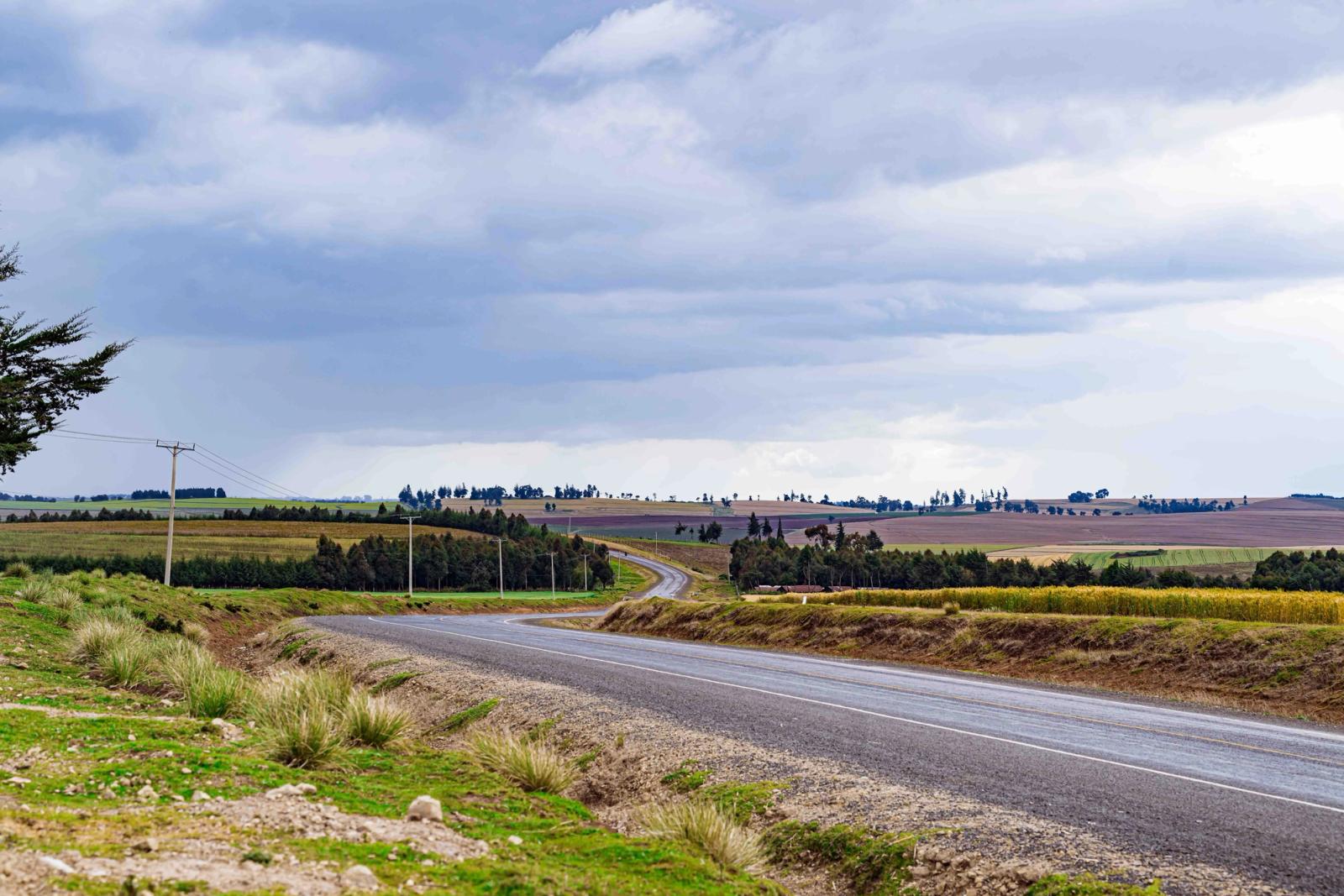 Dramatic countryside road landscape in Mau Narok, Nakuru County, Kenya under cloudy skies
