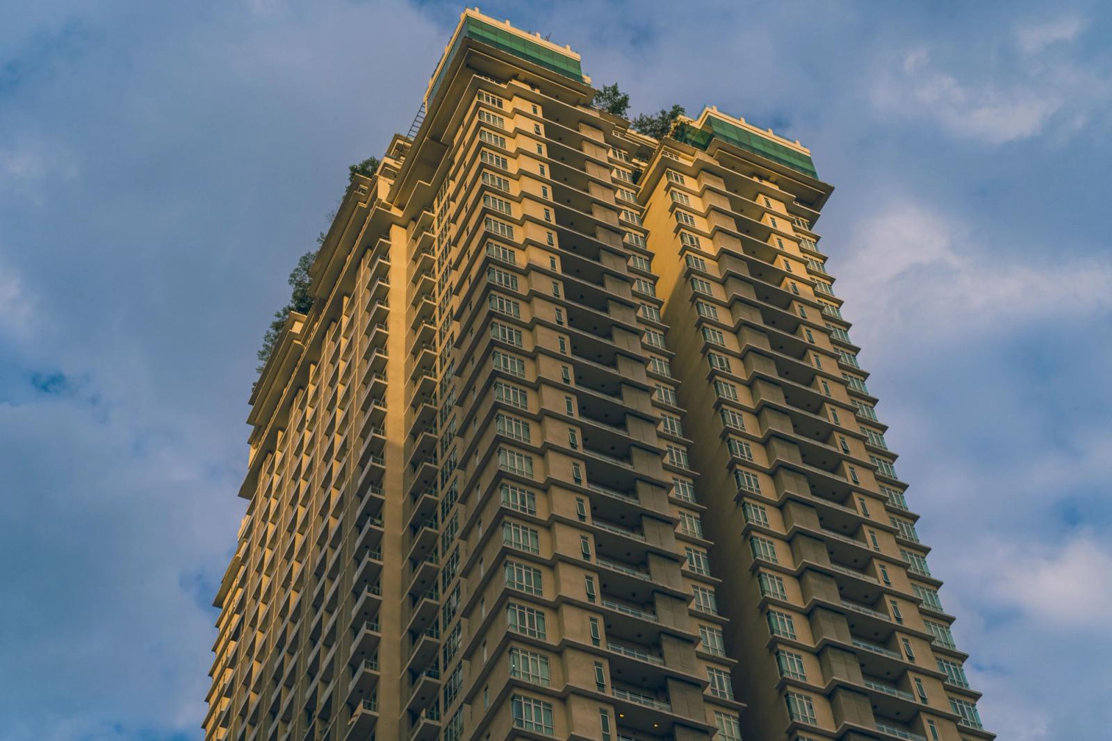 Dramatic low-angle view of a residential skyscraper in Kuala Lumpur, Malaysia