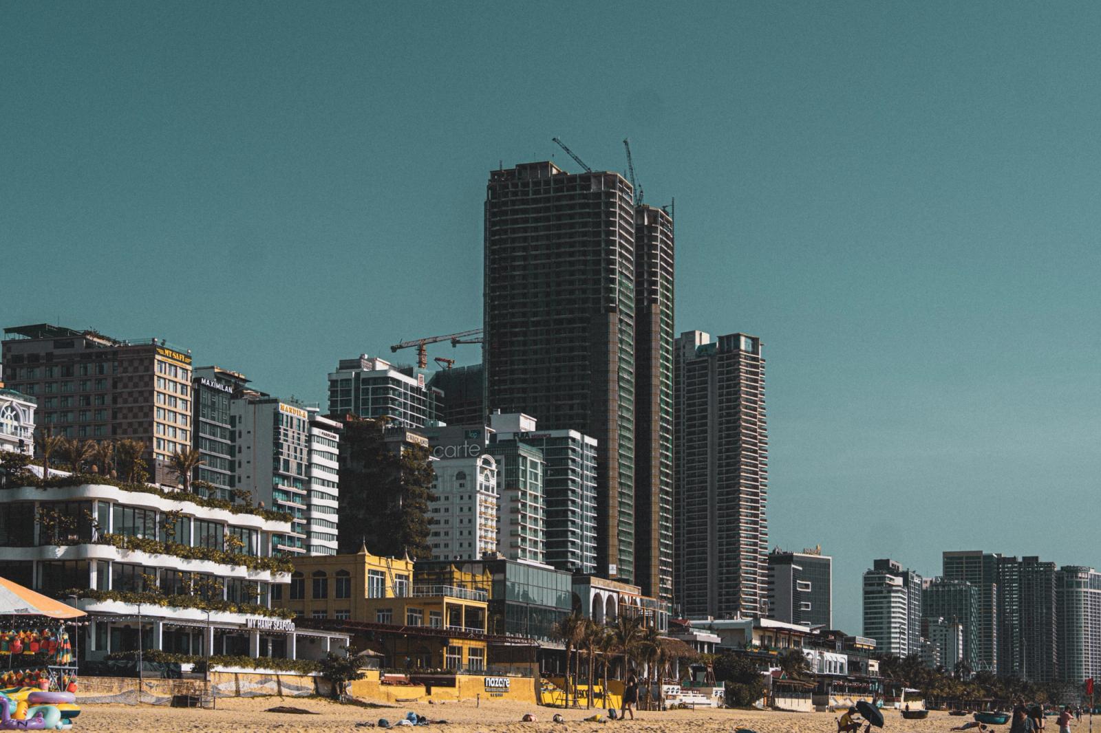 Urban skyline of Da Nang, Vietnam with high-rise buildings along the beachfront, showcasing modern architecture