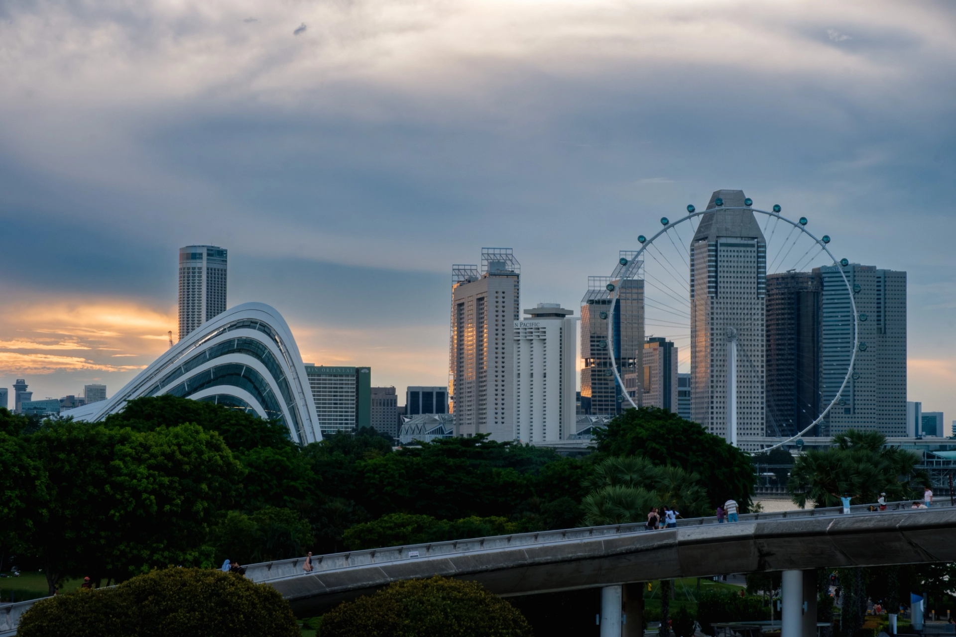 Dramatic Singapore skyline with iconic landmarks at sunset, capturing urban beauty
