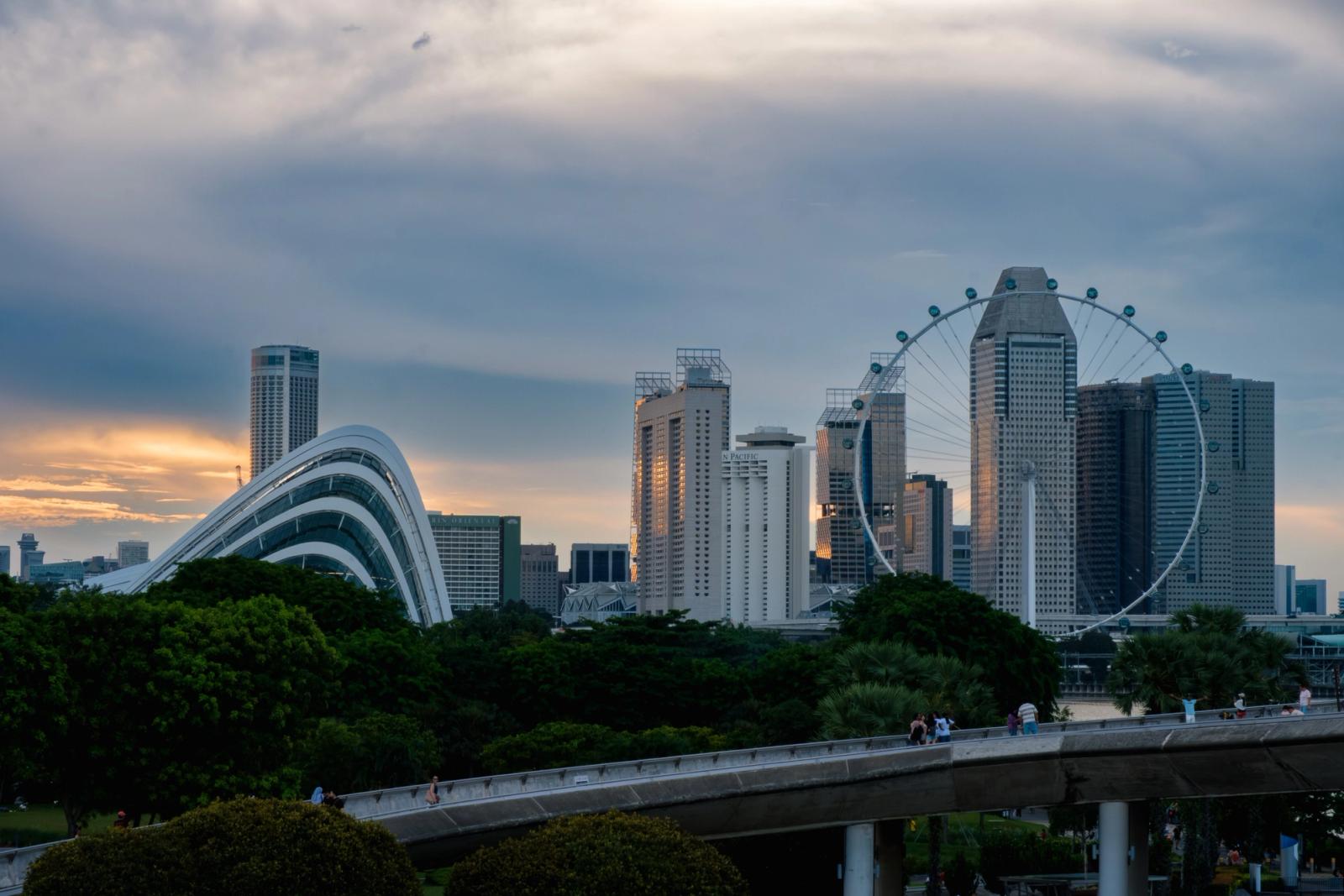 Dramatic Singapore skyline with iconic landmarks at sunset, capturing urban beauty