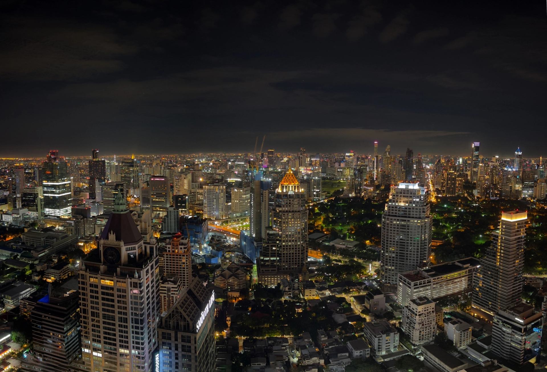 A breathtaking aerial view of Bangkok's vibrant cityscape illuminated at night