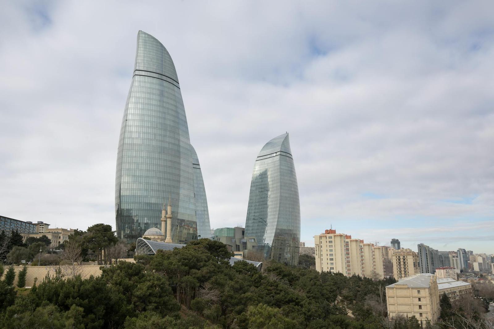 Stunning view of Baku's Flame Towers with surrounding urban park and cityscape