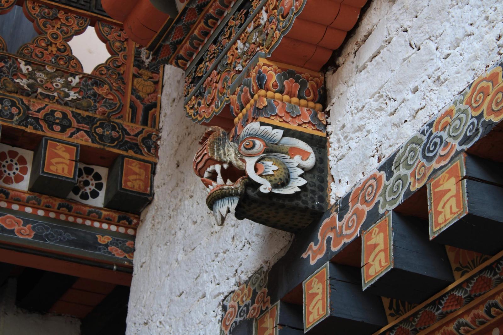 Close-up of a colorful dragon motif in Bhutanese architecture, showcasing cultural artistry