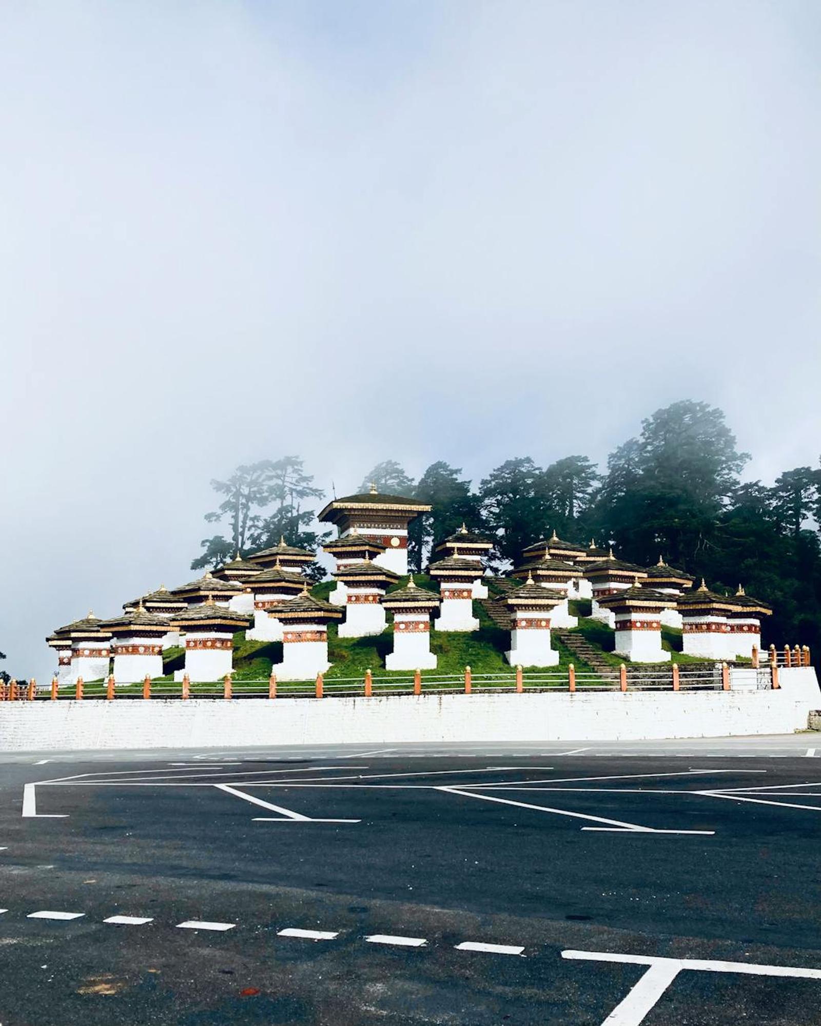 Scenic view of the 108 Druk Wangyal Chortens at Dochula Pass shrouded in mist