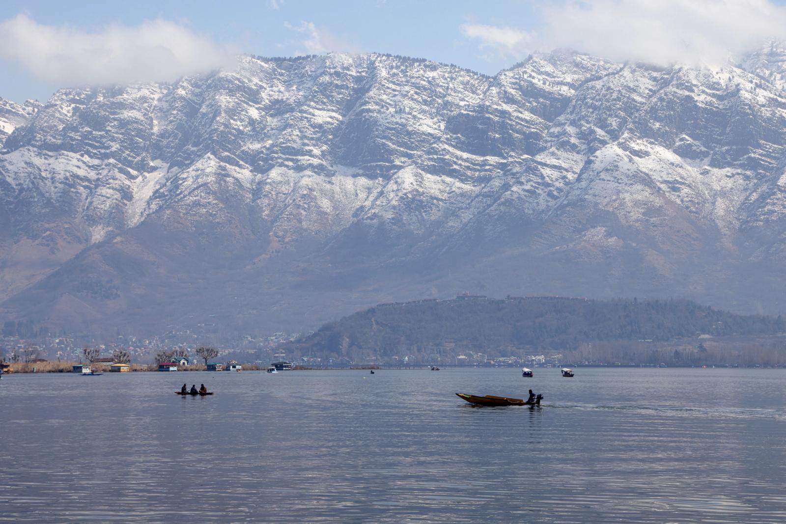 Breathtaking view of Dal Lake with snowy Himalayas in the background in Srinagar