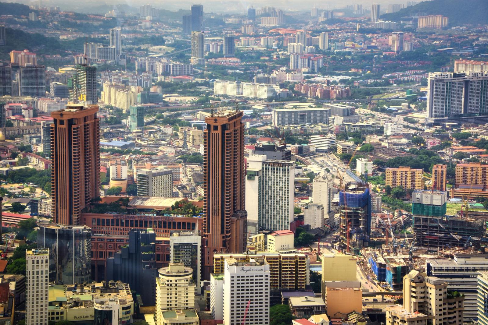 Stunning aerial view of bustling Kuala Lumpur showcasing iconic skyscrapers and urban landscape