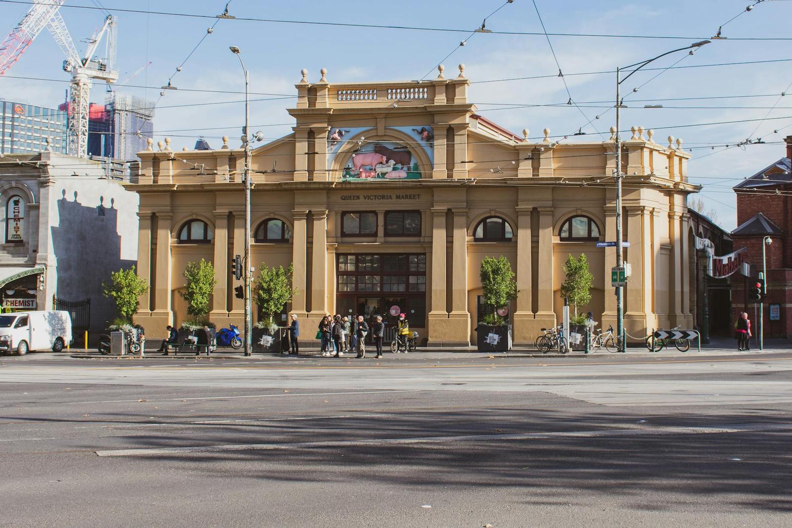 Street view of Queen Victoria Market with people and bicycles in Melbourne, Australia