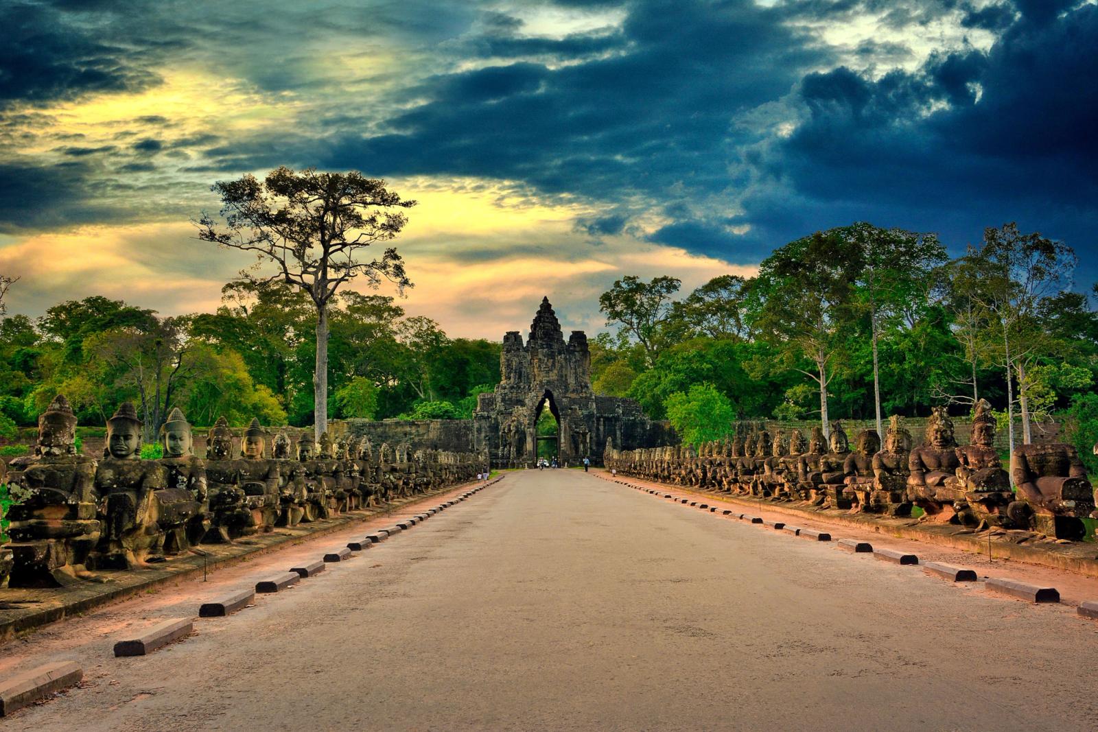 Stunning sunset over historic Angkor Thom gate in Siem Reap, Cambodia