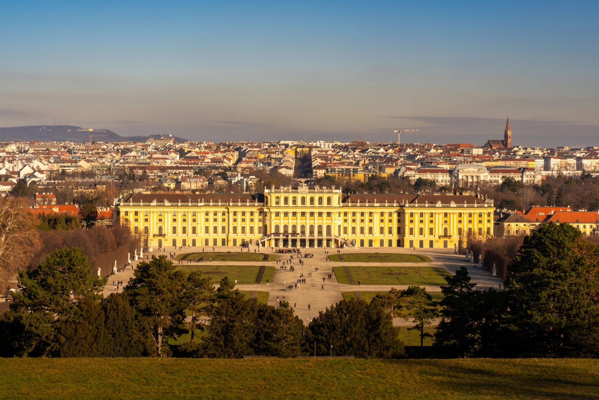 Panoramic view of Schonbrunn Palace in Vienna, Austria under a clear daytime sky