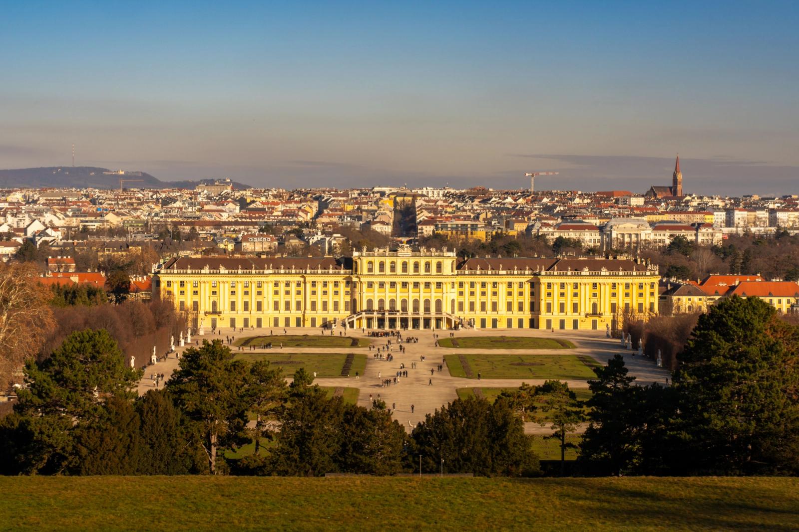 Panoramic view of Schonbrunn Palace in Vienna, Austria under a clear daytime sky