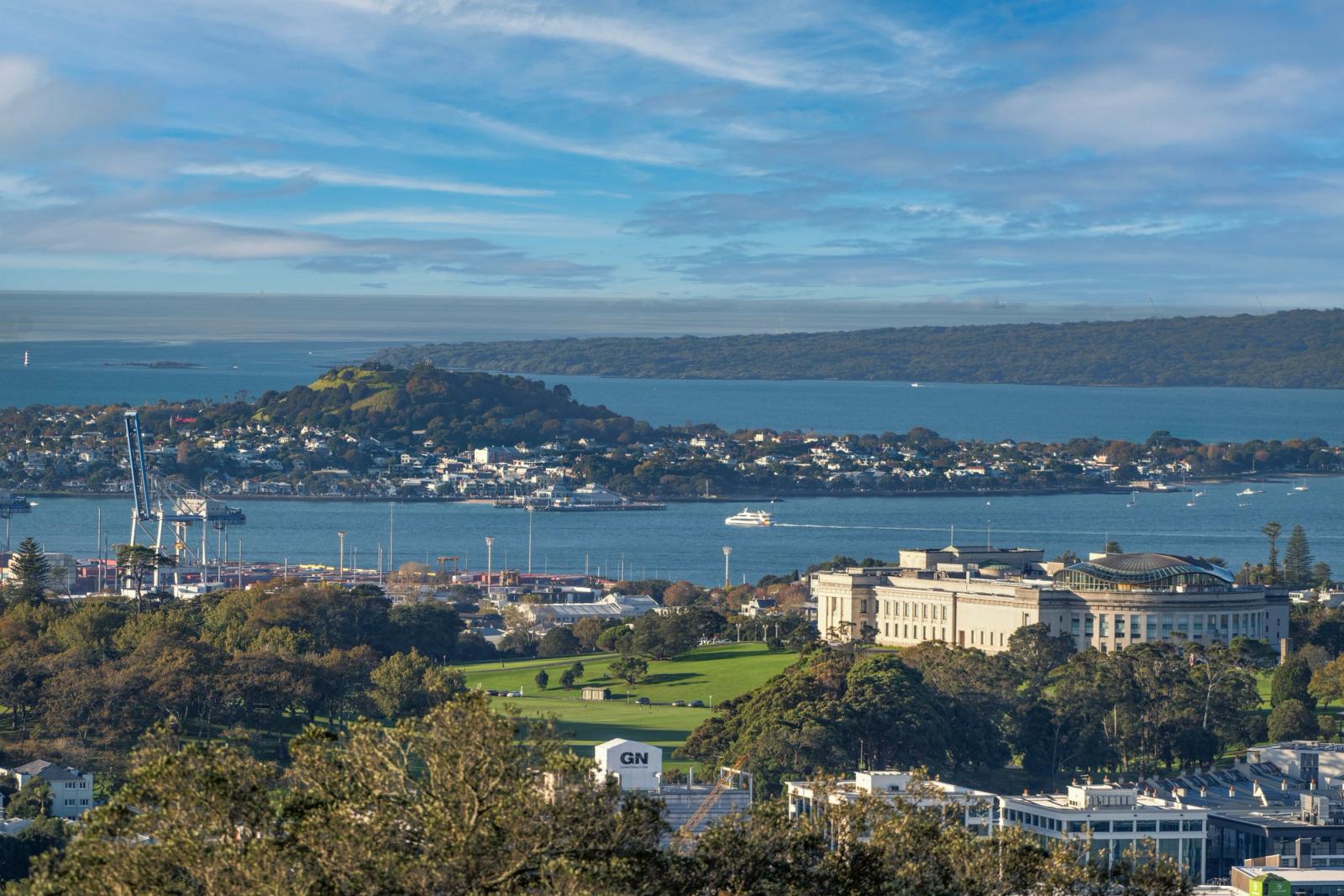 Scenic view of Auckland Museum, harbor, and city skyline on a clear day