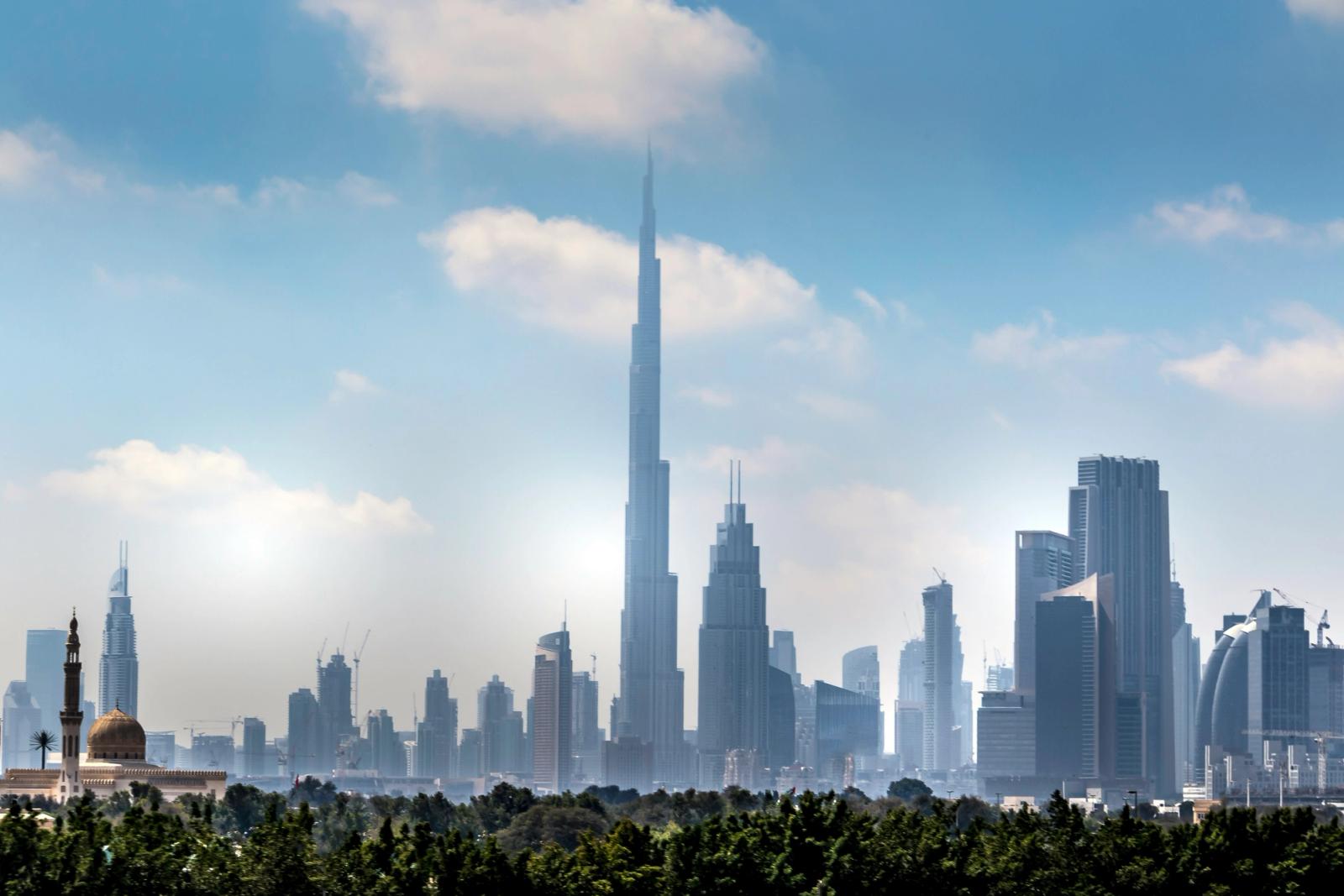 Dubai skyline with the Burj Khalifa rising above the city at midday