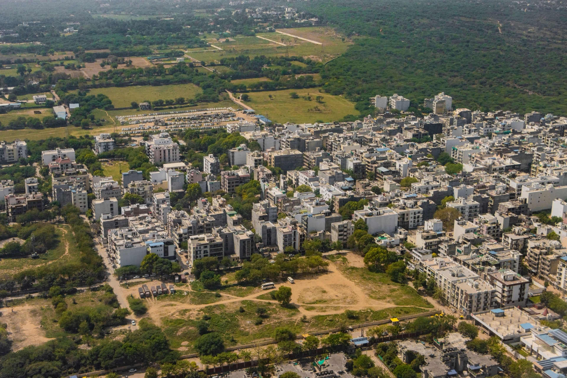 Stunning aerial view of Gurugram, India's vibrant urban landscape and green surroundings