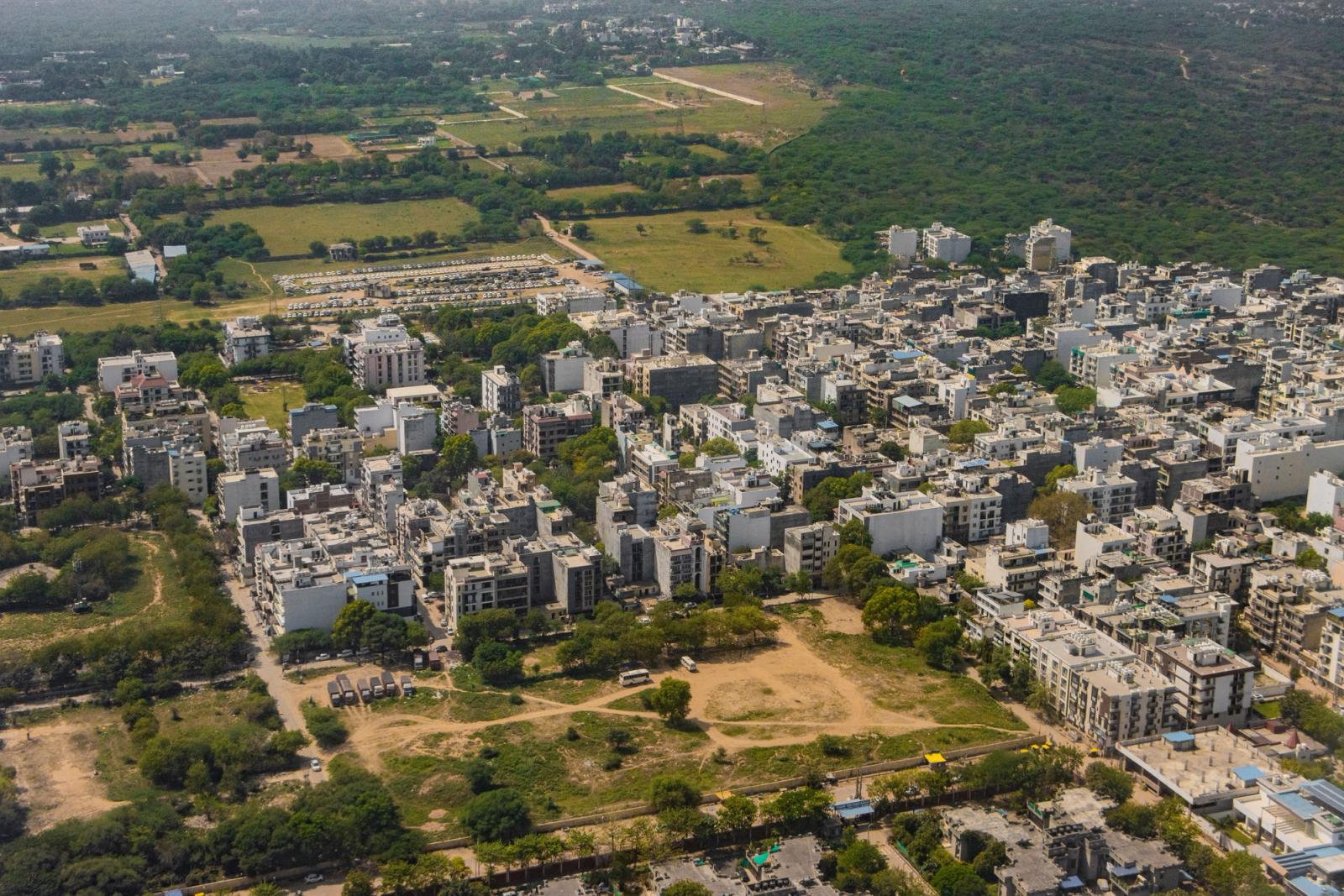 Stunning aerial view of Gurugram, India's vibrant urban landscape and green surroundings