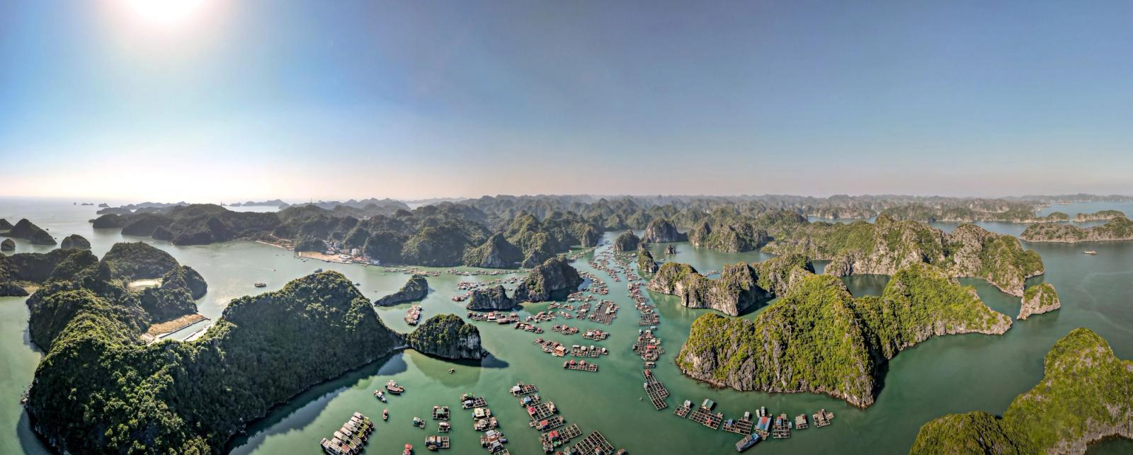 Panoramic aerial view of Ha Long Bay's picturesque islands and floating villages