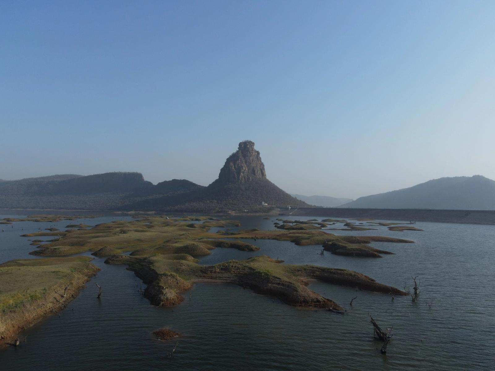 A breathtaking view of a rugged island and clear sky in Karamchat, India. Ideal for nature enthusiasts