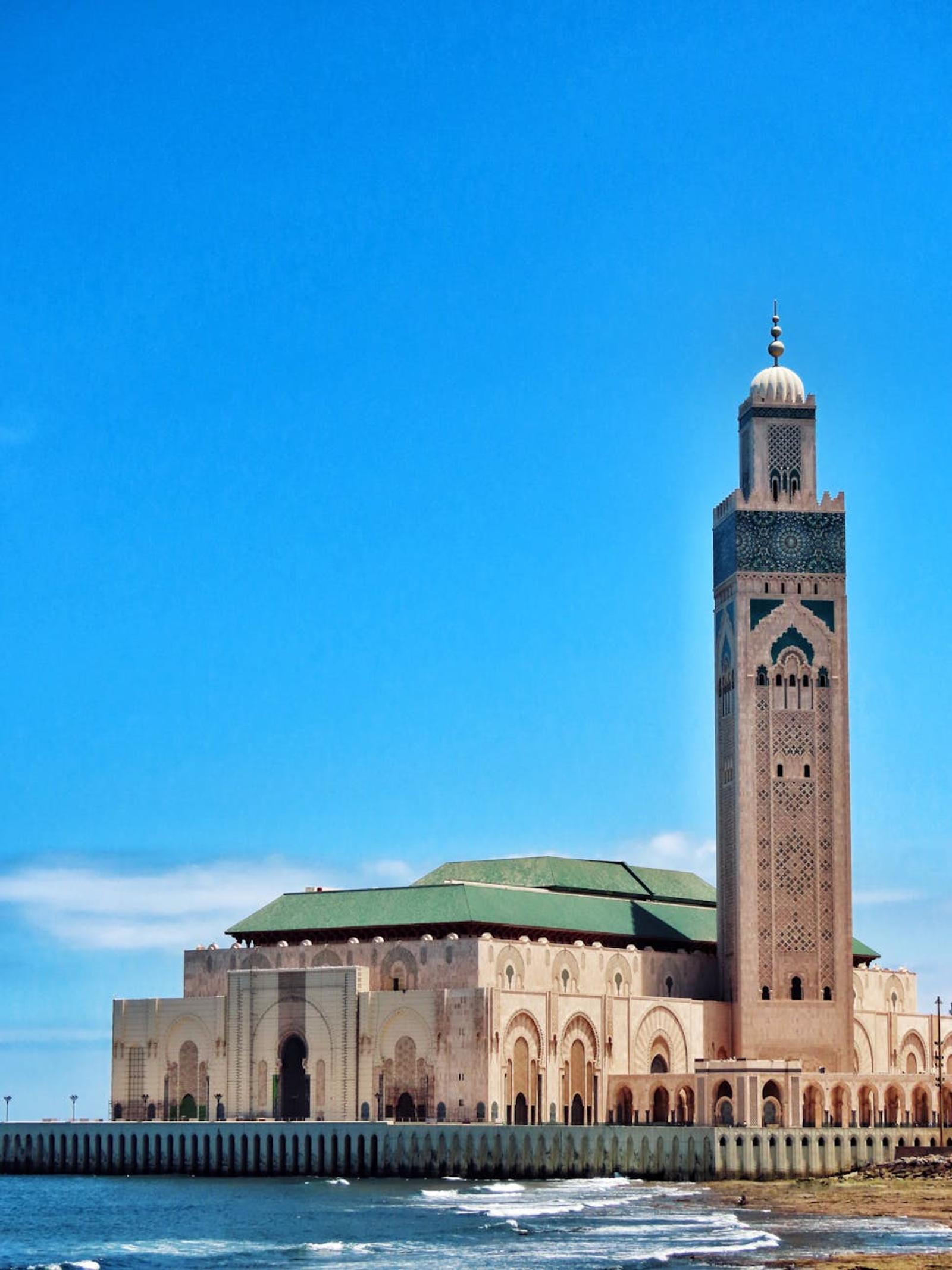 Stunning view of Hassan II Mosque's minaret against the ocean in Casablanca, Morocco