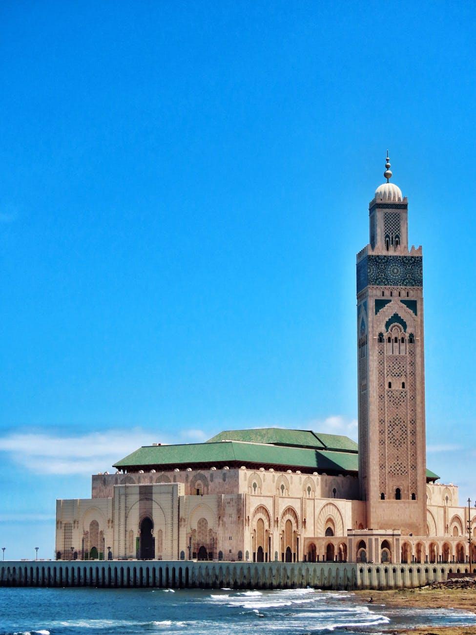 Stunning view of Hassan II Mosque's minaret against the ocean in Casablanca, Morocco